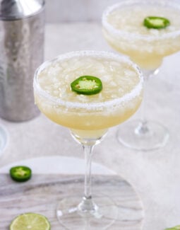Skinny Spicy Margarita in a margarita glass with salt and a slice of jalapeno
