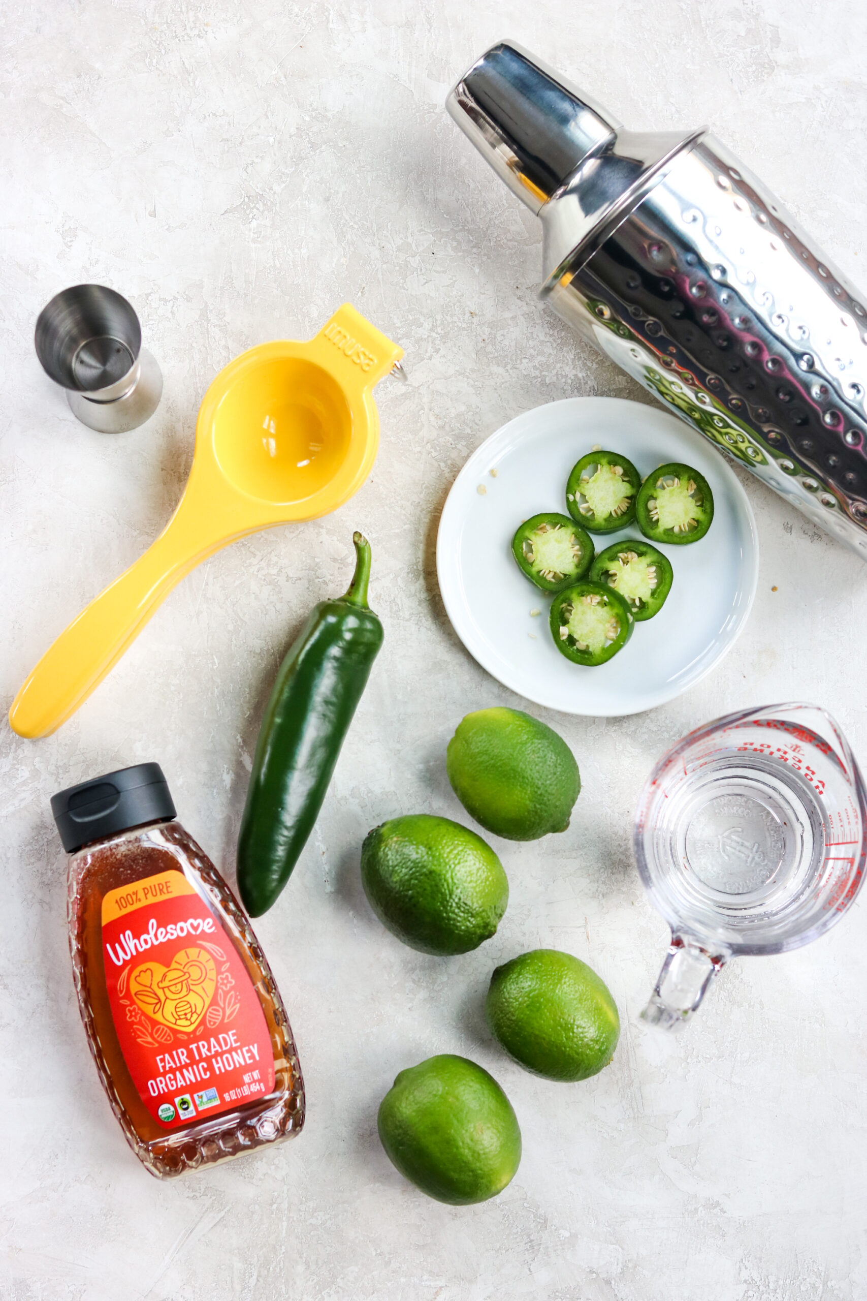 Ingredients for spicy skinny margaritas: honey, limes, jalapeno, and tequila