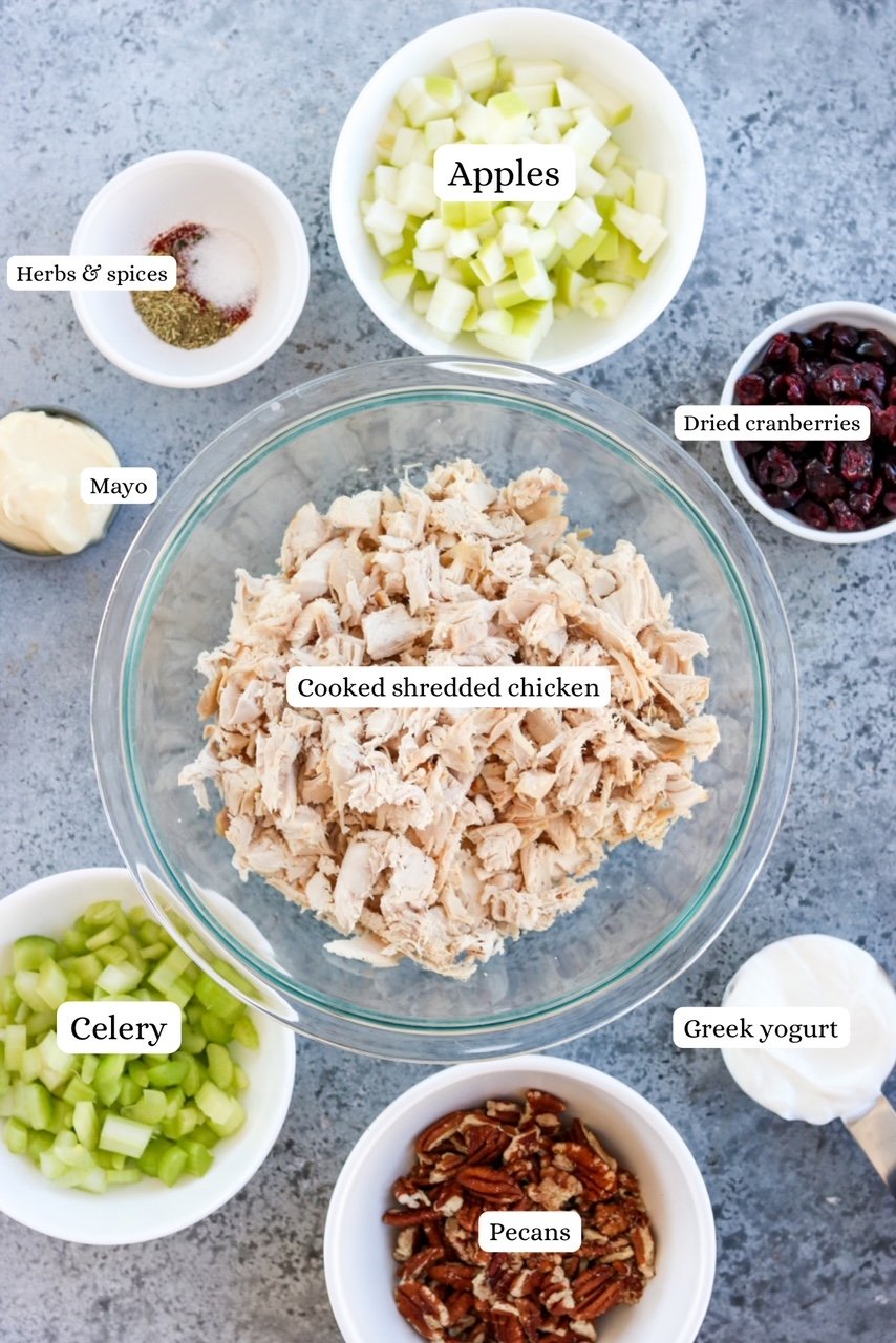 ingredients for cranberry pecan chicken salad in nesting bowls