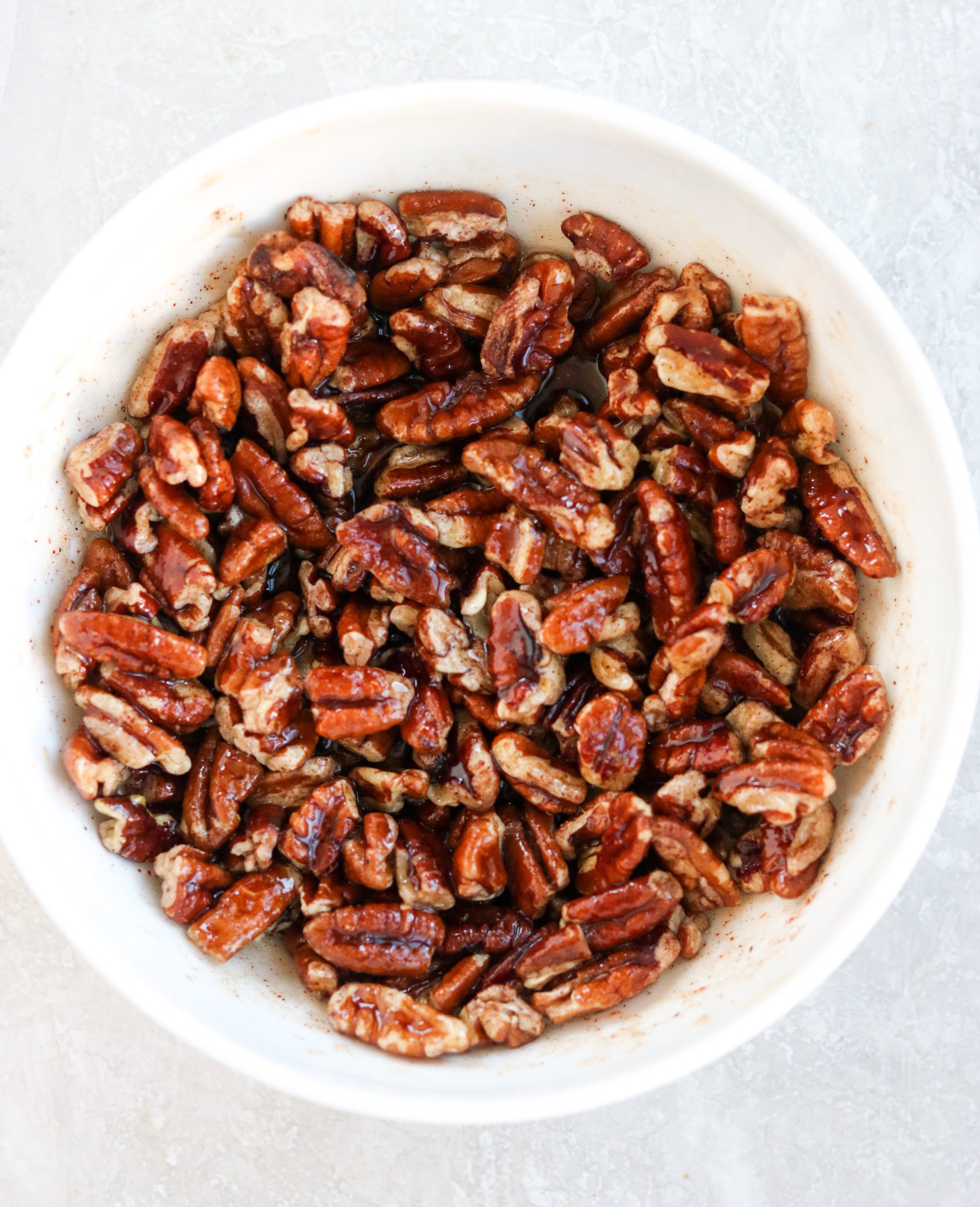 the pecan topping in a white bowl
