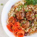 Asian pork meatball bowls with fried rice and carrot spirals