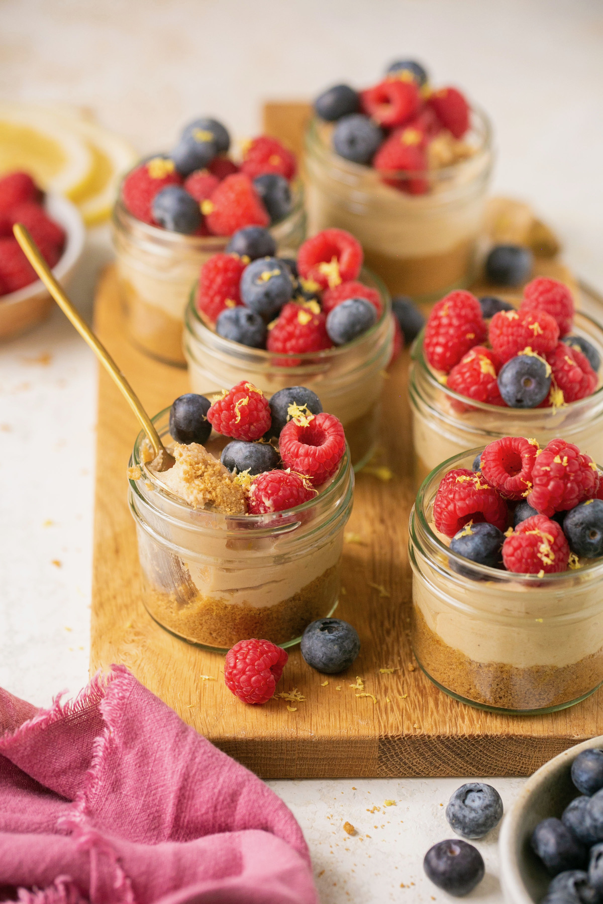 mini cheesecake jars topped with berries