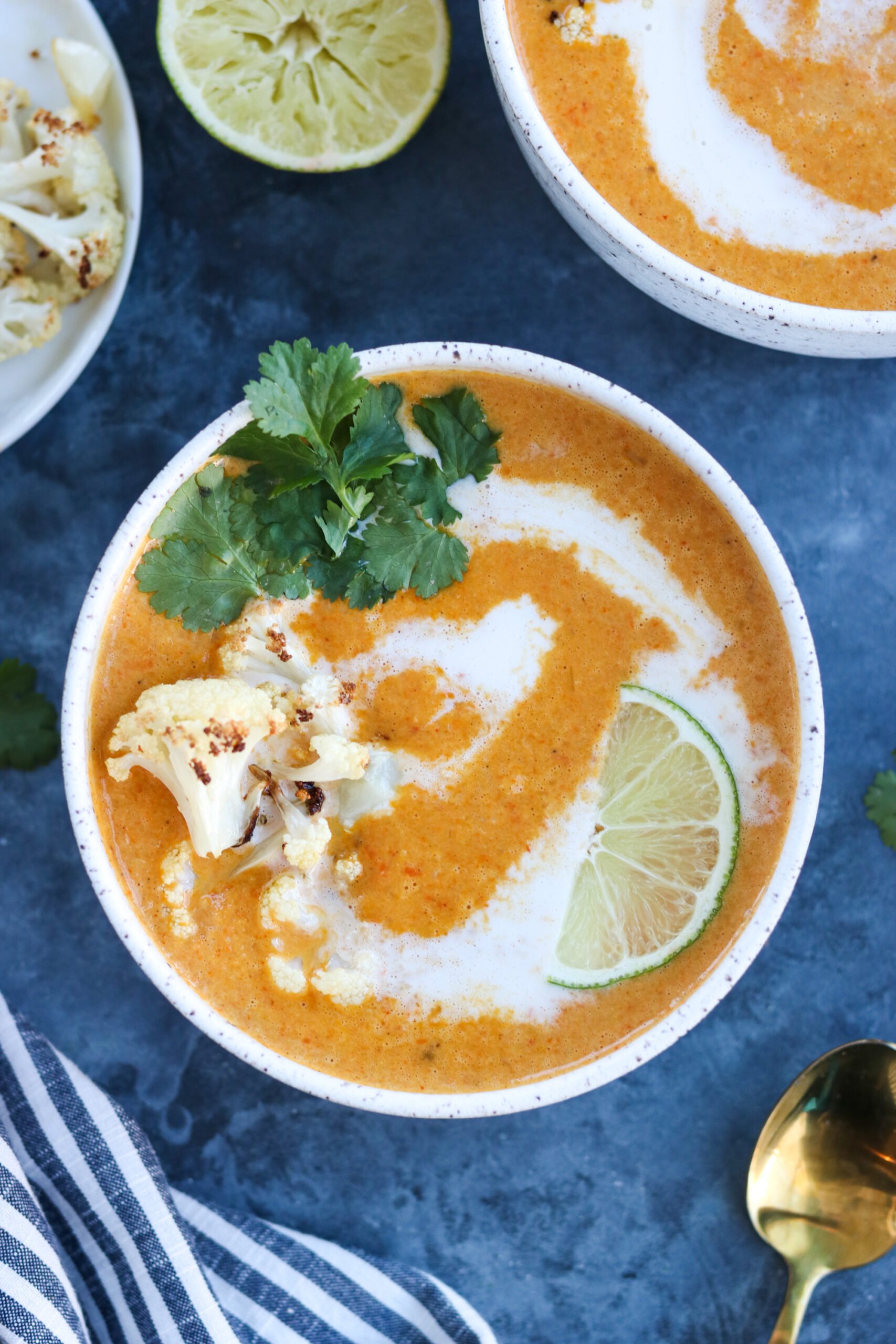 Curried Cauliflower Carrot Soup in a white bowl