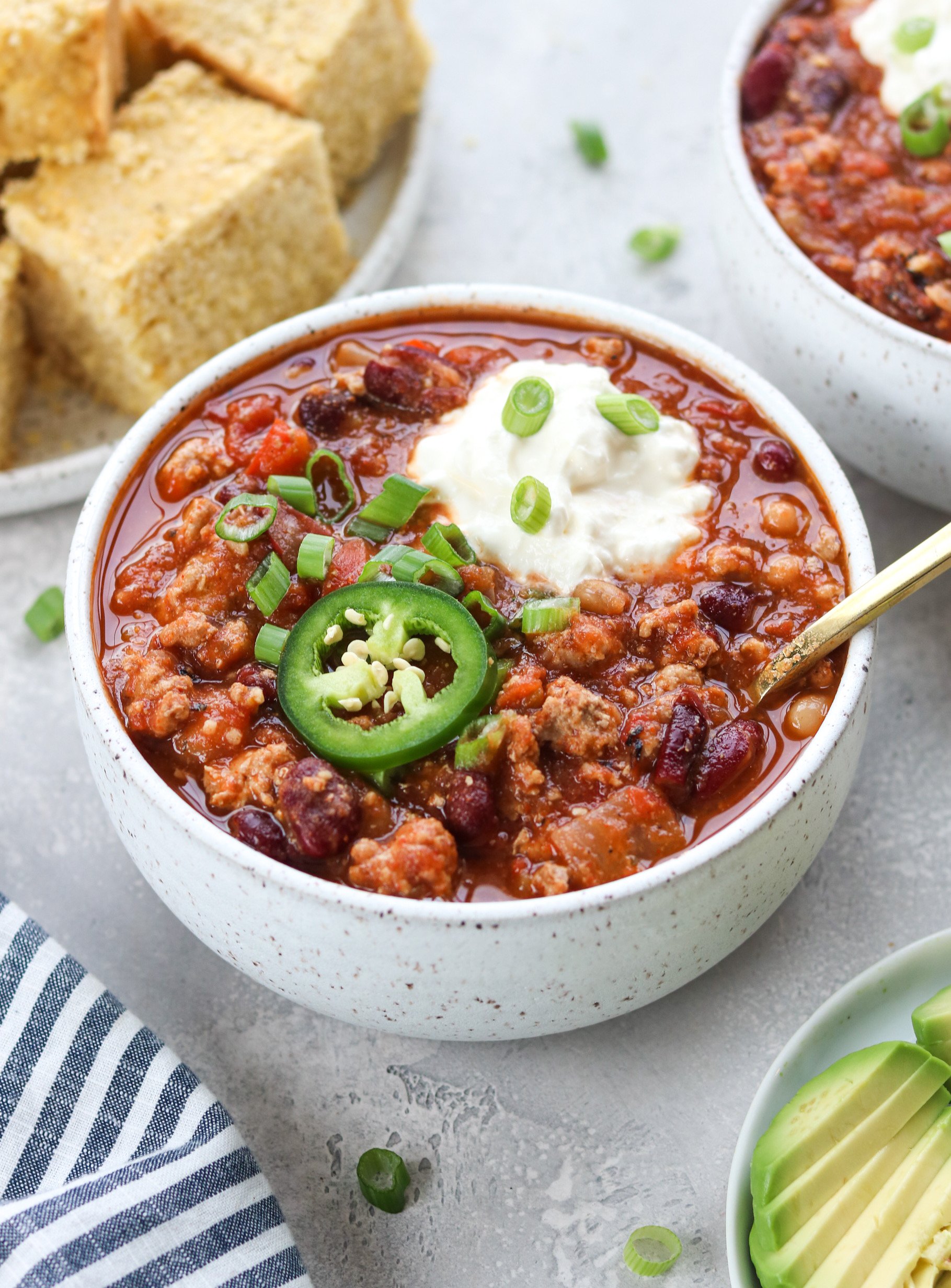 Slow cooker turkey chili with sour cream and jalapeño