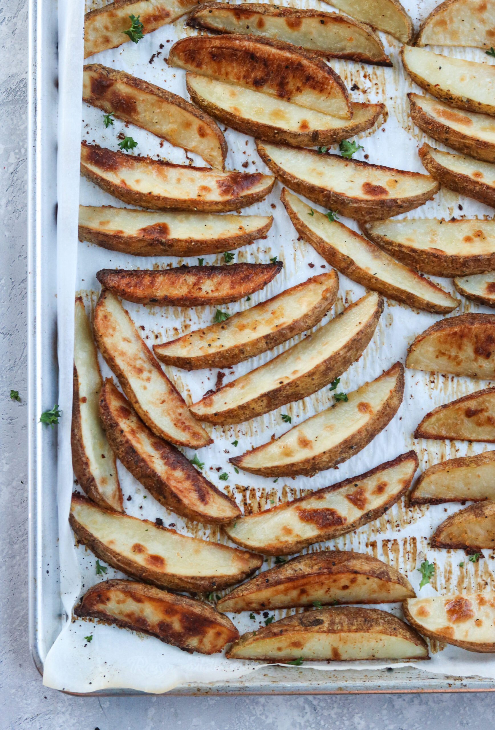 Crispy Baked Potato Wedges on a pan with sheet