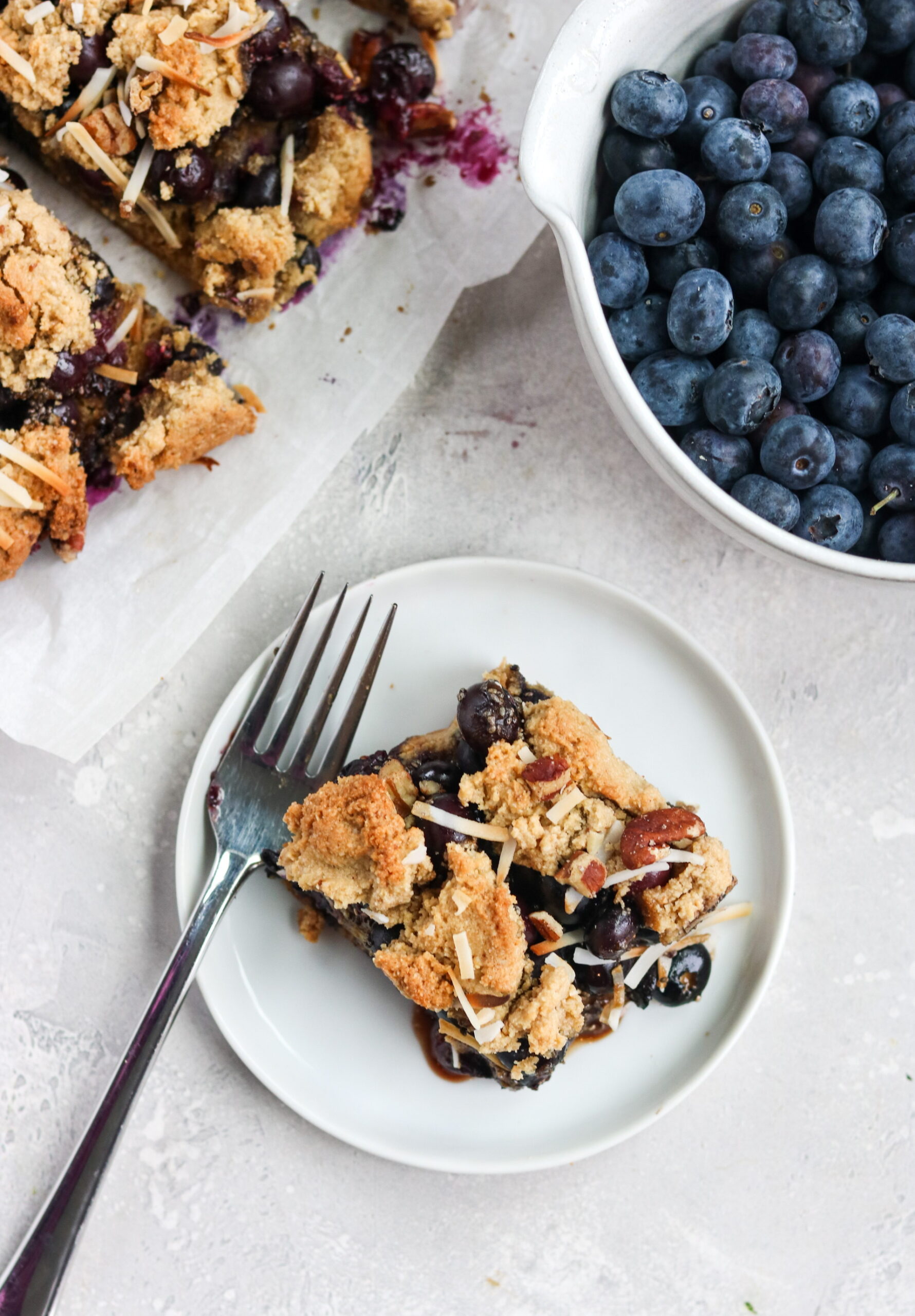 Blueberry Bars and blueberries on a table