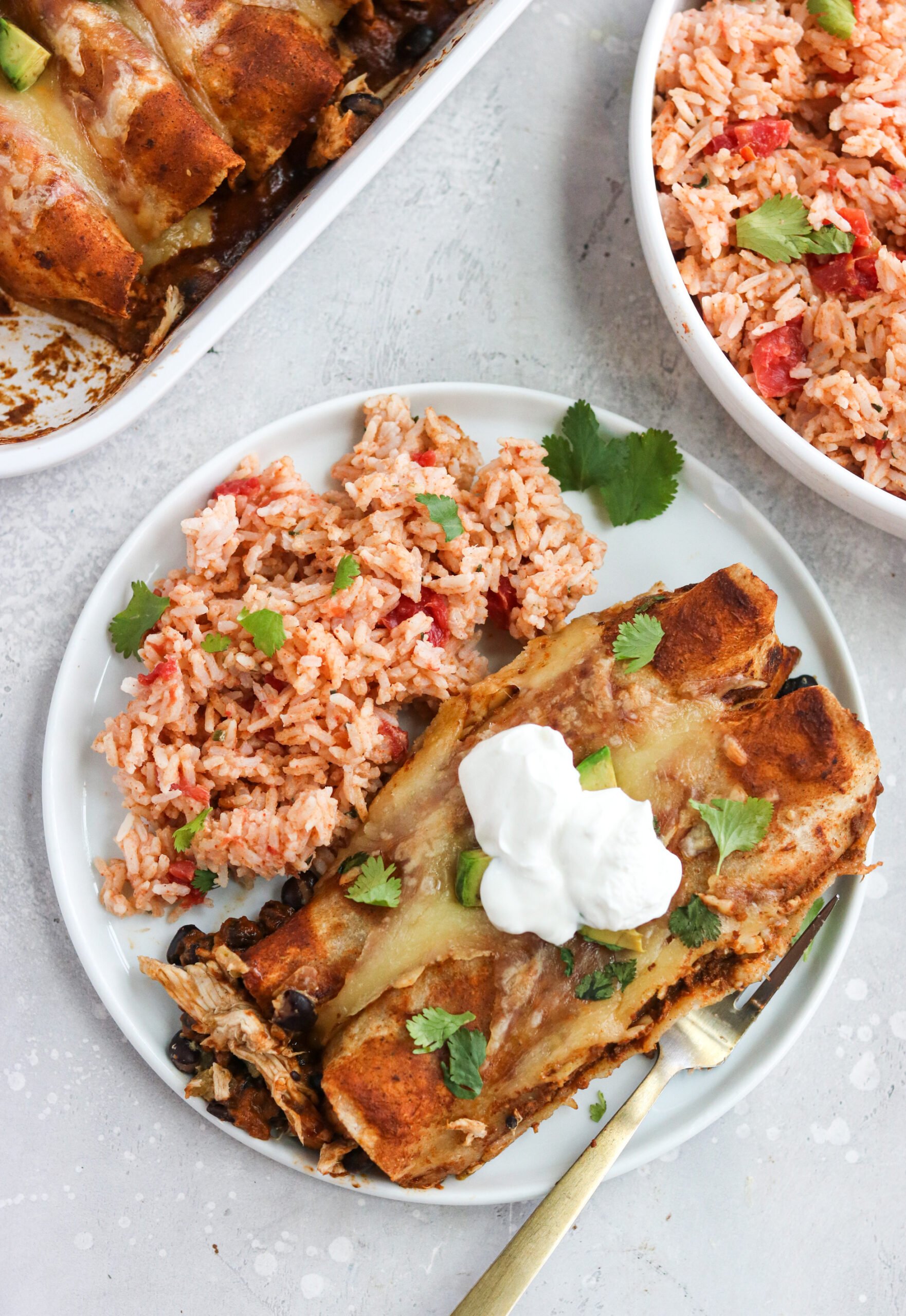 Instant Pot Mexican Rice and chicken enchilada in a white plate
