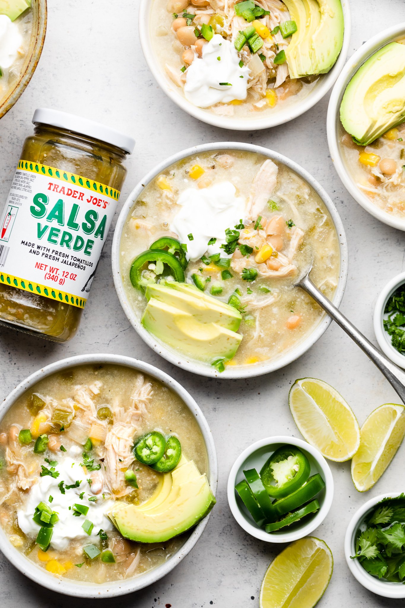 Slow Cooker Salsa Verde Chicken Chili in white small bowls