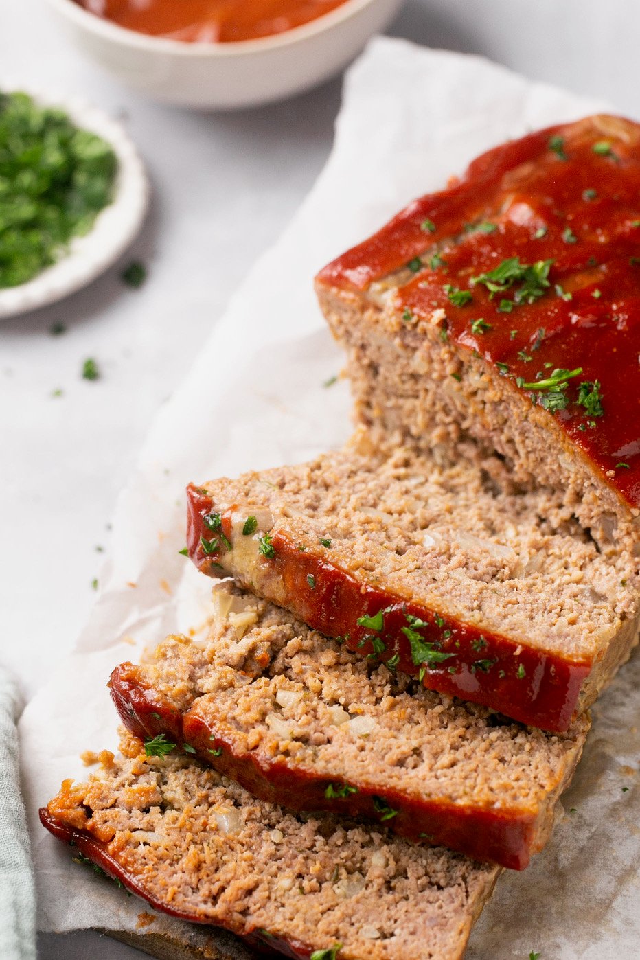 gluten free meatloaf topped with parsley and sliced