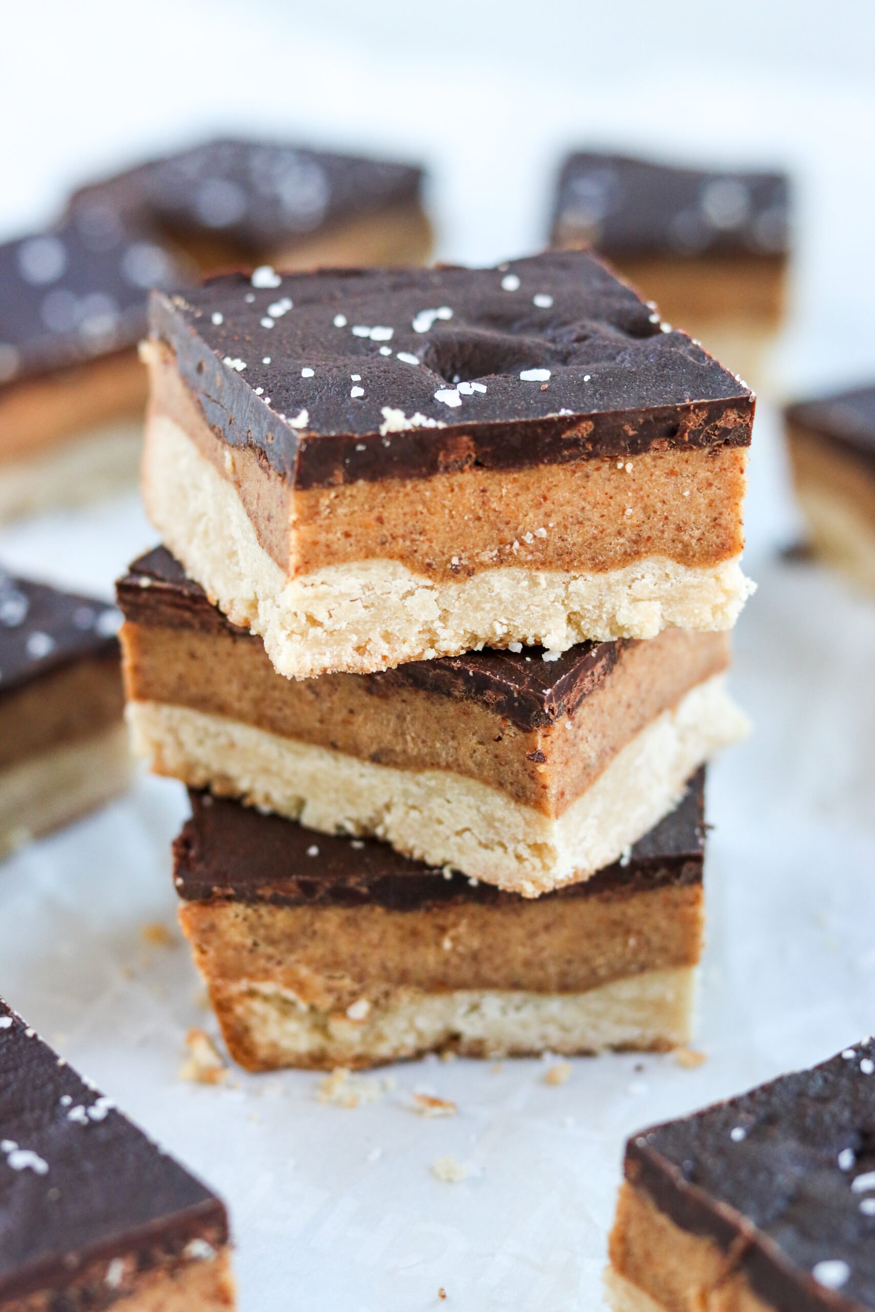 Gluten Free shortbread bars stacked on top of each other with sea salt. 