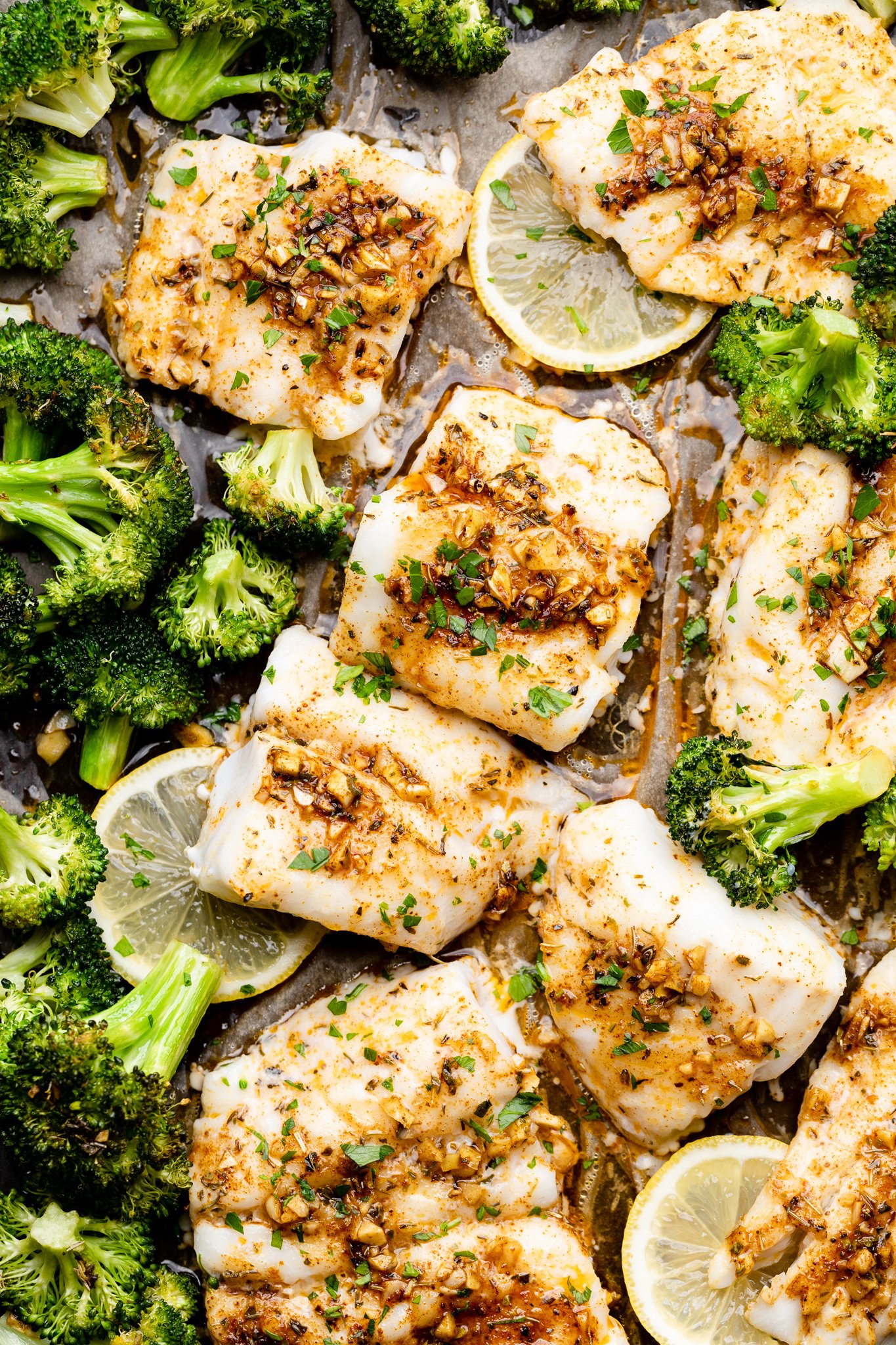 Cajun butter cod and broccoli on a sheet pan
