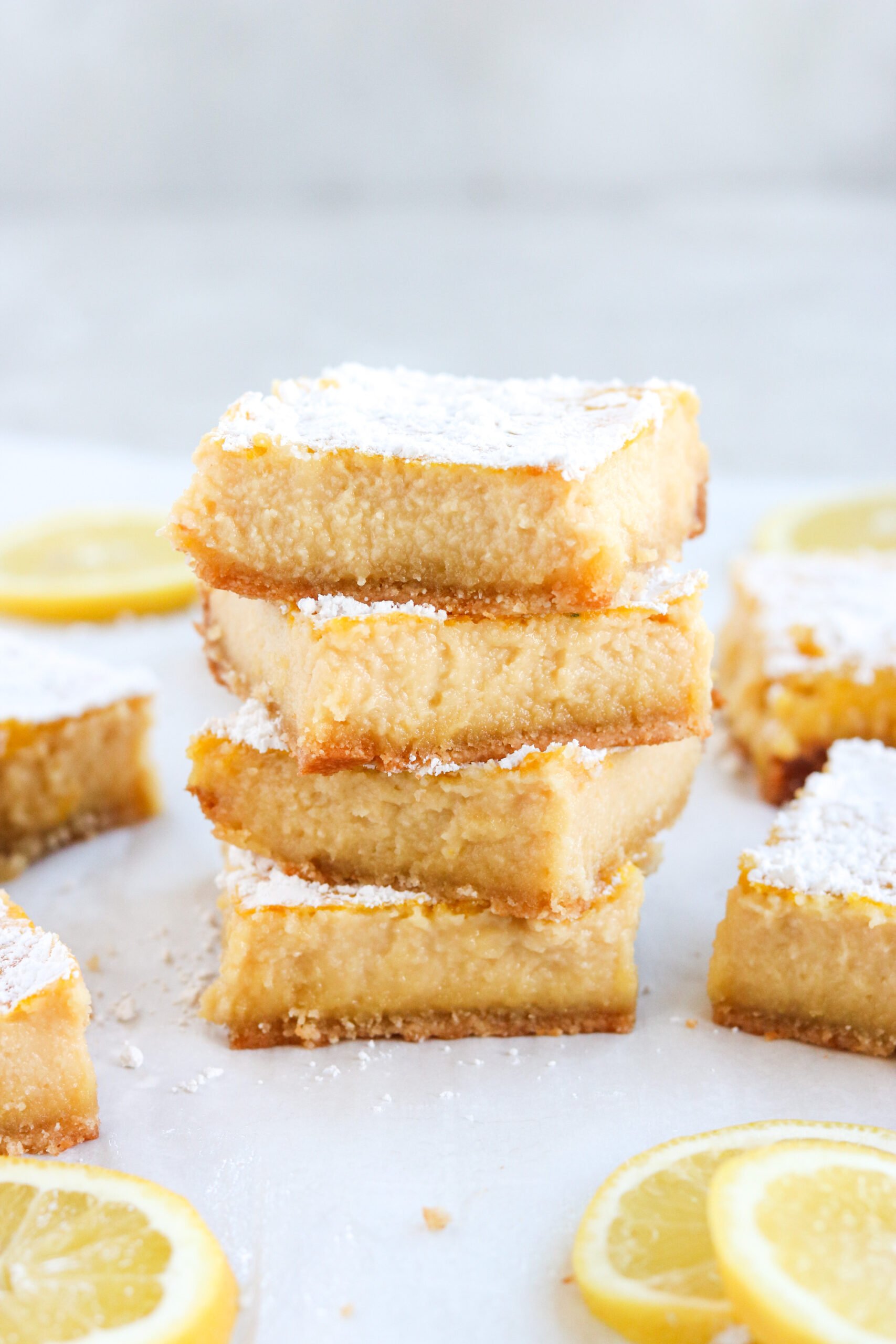 a stack of paleo lemon bars dusted with powdered sugar
