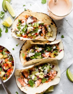 3 blackened salmon tacos in paleo tortillas with pineapple salsa and lime aioli