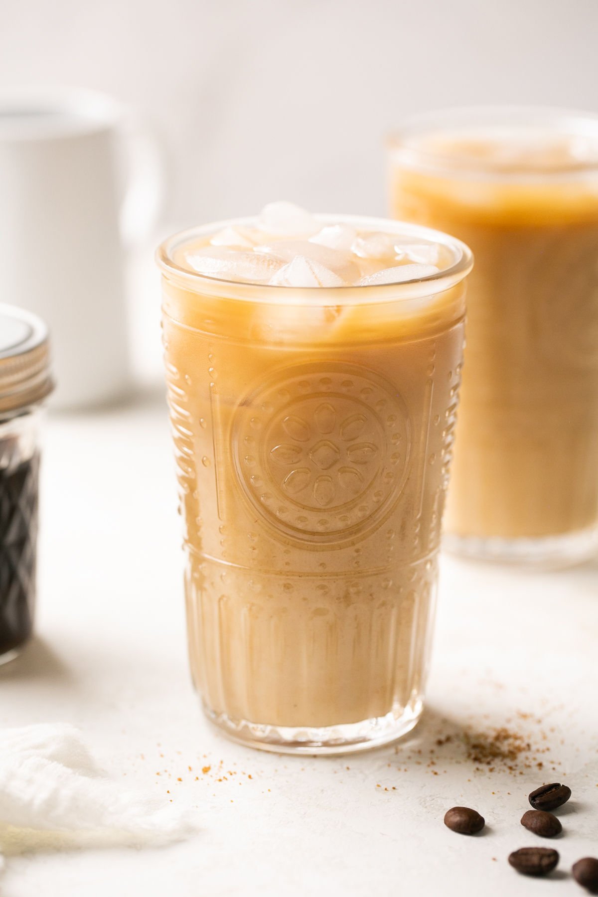 an up close shot of a tall glass filled with brown sugar shaken espresso and ice. 