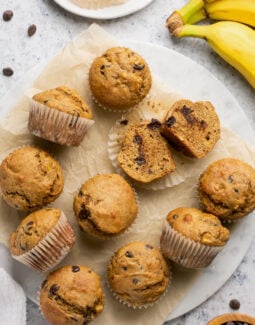 banana protein muffins on a piece of parchment paper