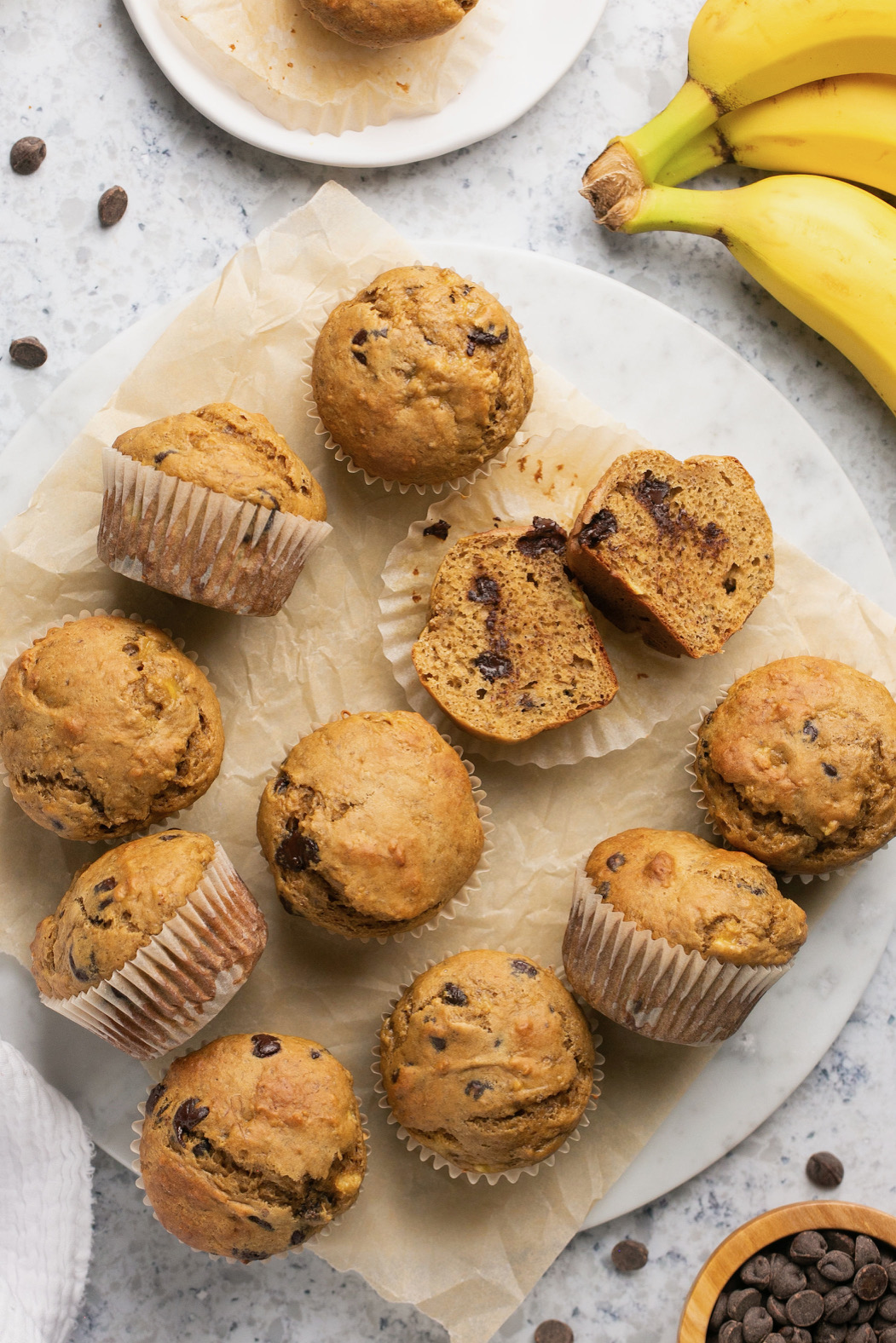 banana protein muffins on a lined plate