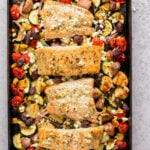 sheet pan salmon and vegetables with Greek Marinade and feta on a sheet pan