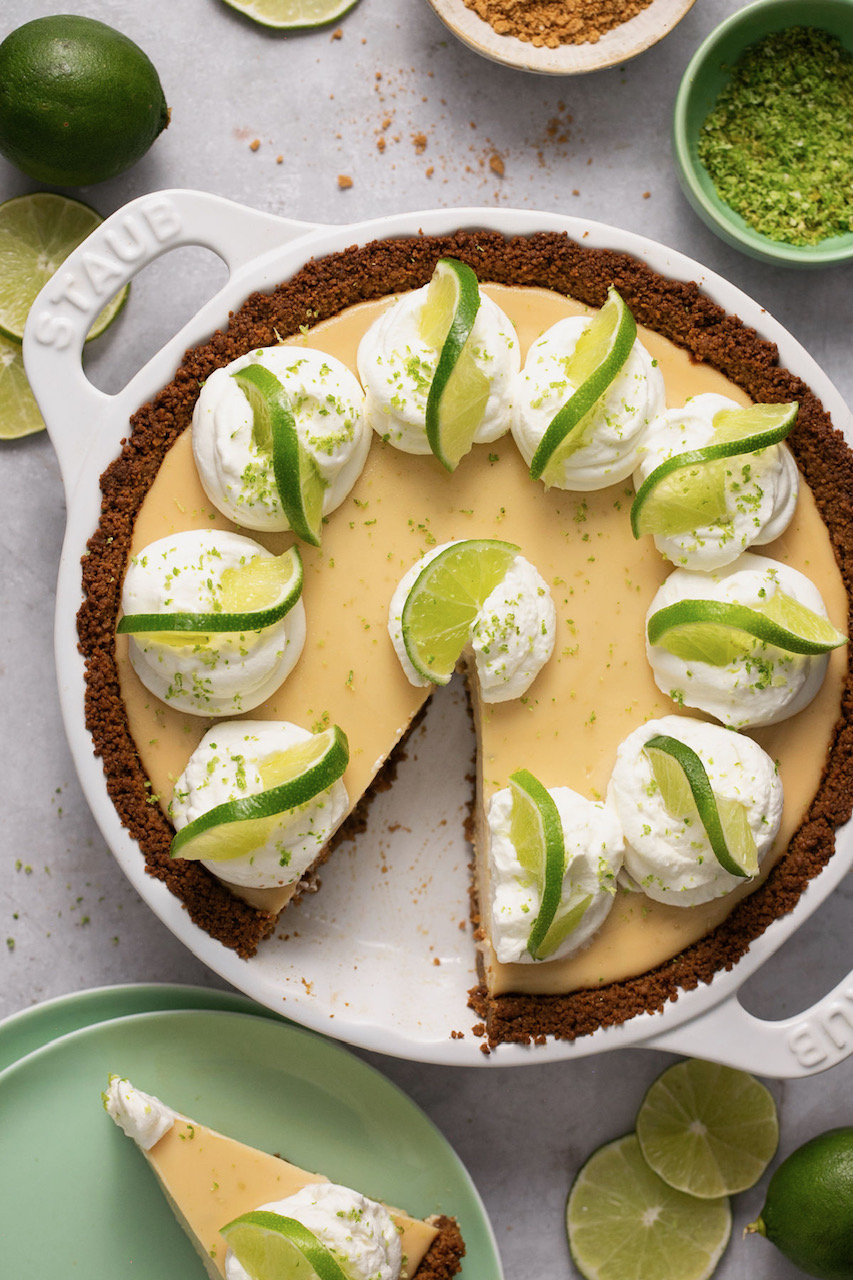 an overhead shot of gluten-free key lime pie with a slice taken out