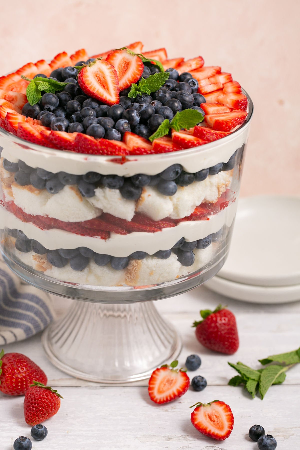 berry angel food trifle with mint in a glass bowl