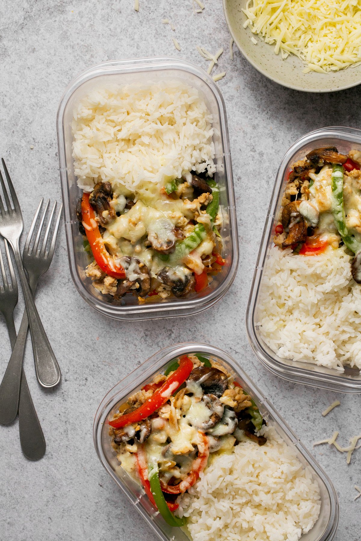 chicken philly cheesteak meal prep bowls in glass containers 