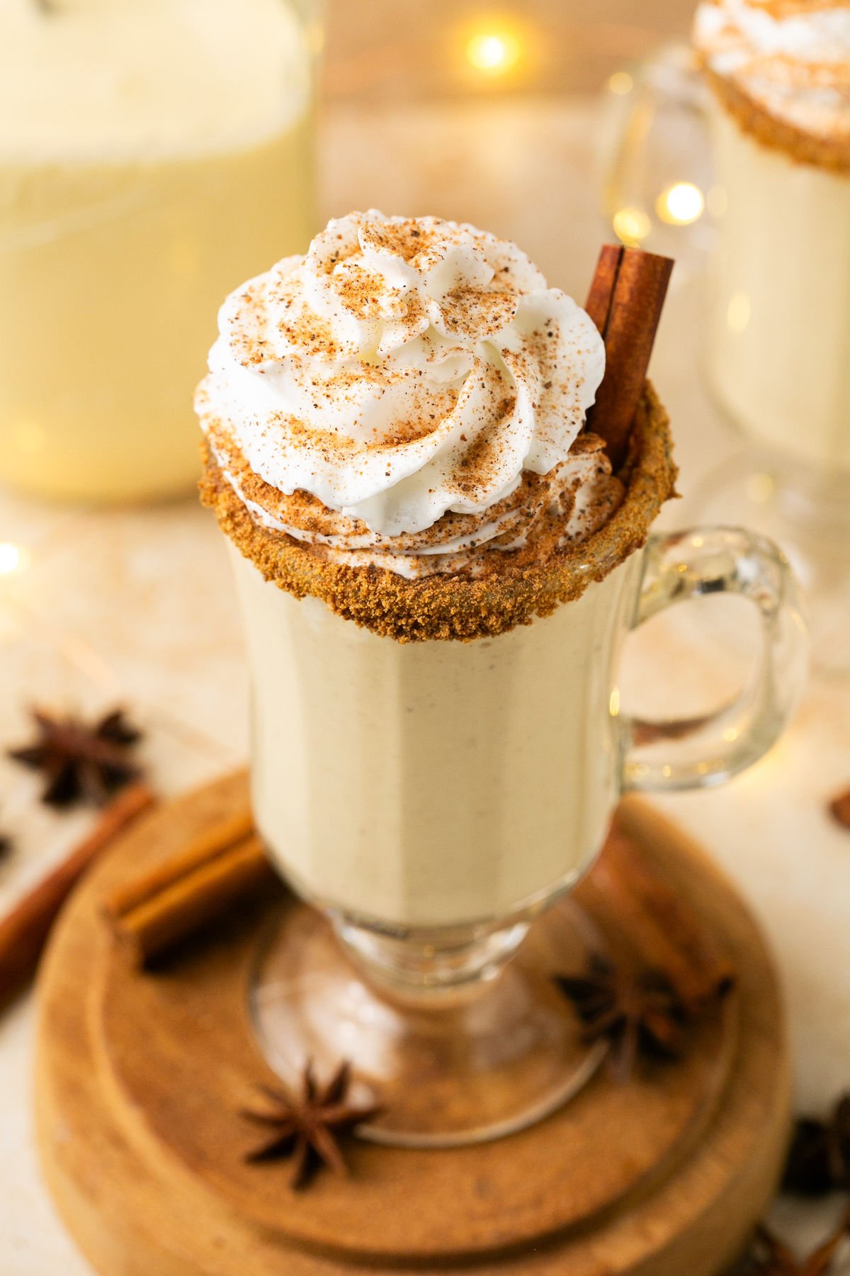 eggnog in a cup with whipped cream