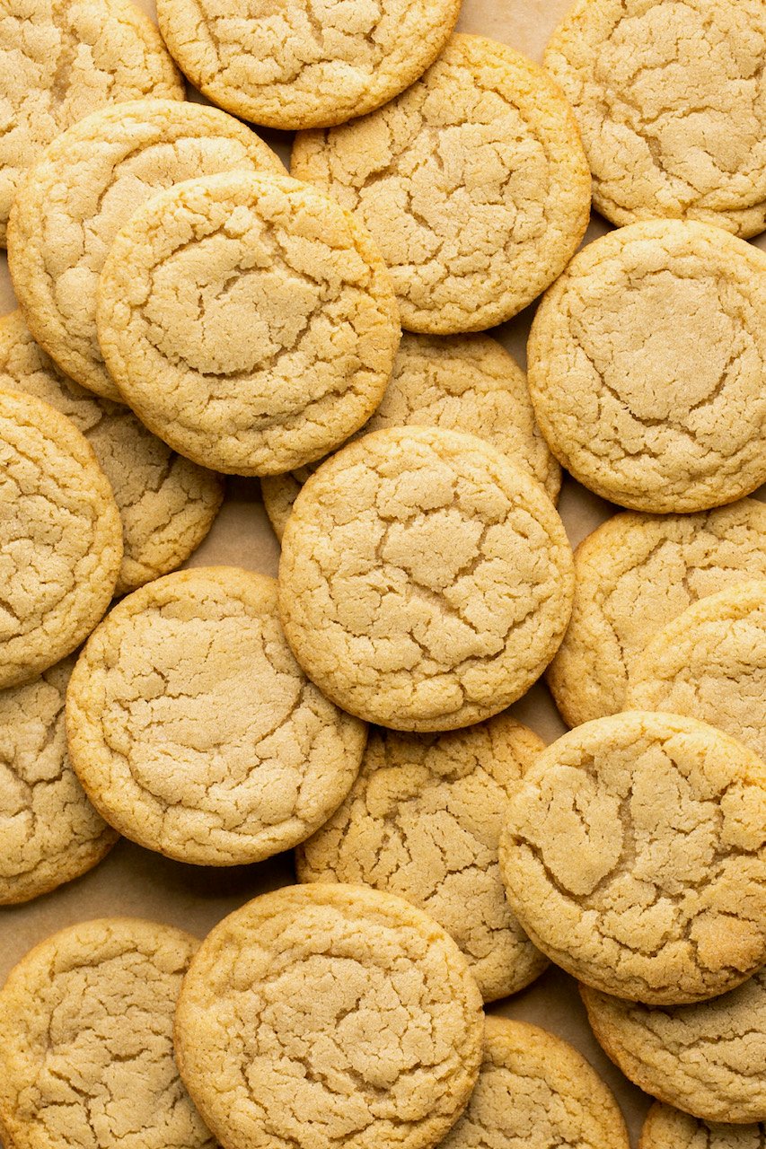 cookies piled on top of each other on parchment paper