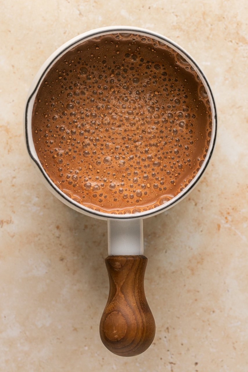 bone broth hot chocolate in a sauce pan