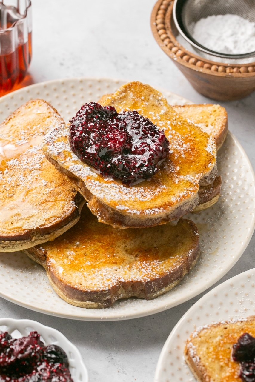 4 slices of french toast on a plate topped with chia jam