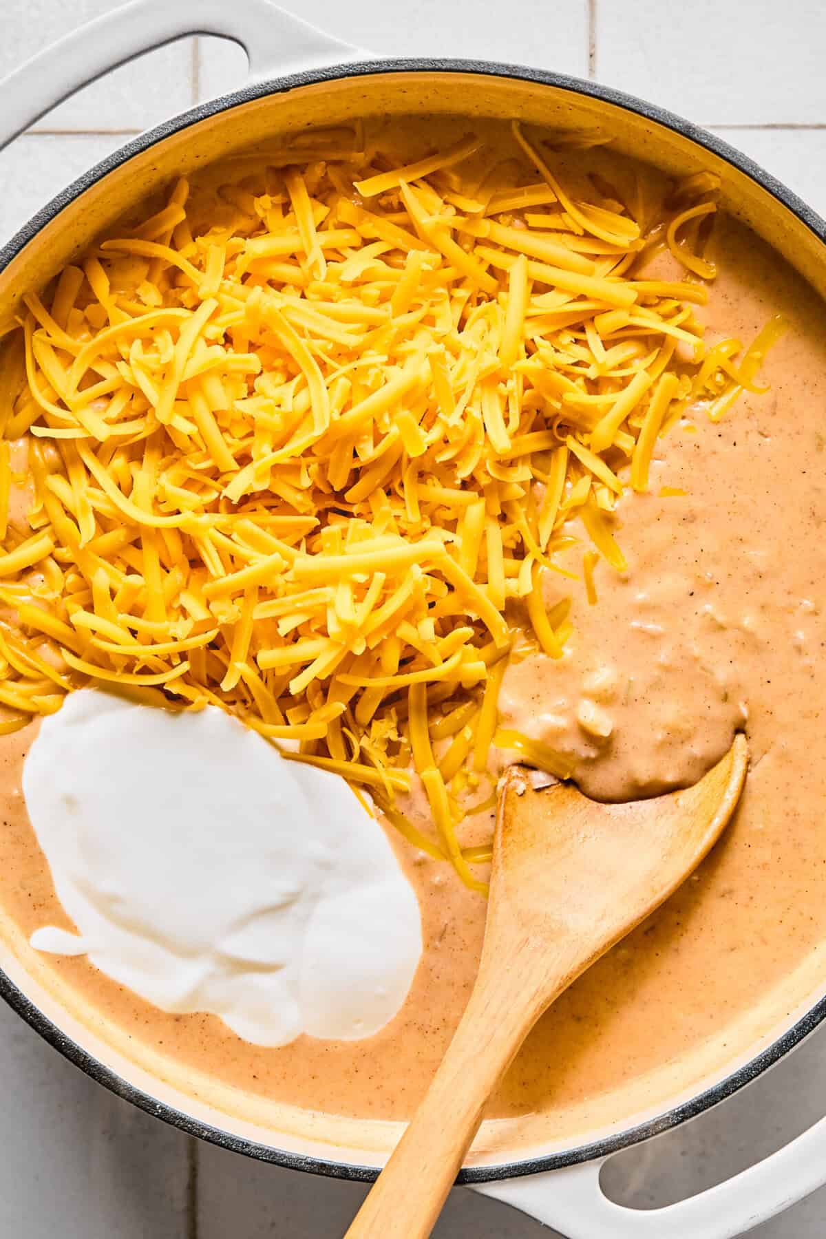 Blended cottage cheese and sharp cheddar in the pan of to create the hashbrown casserole sauce.