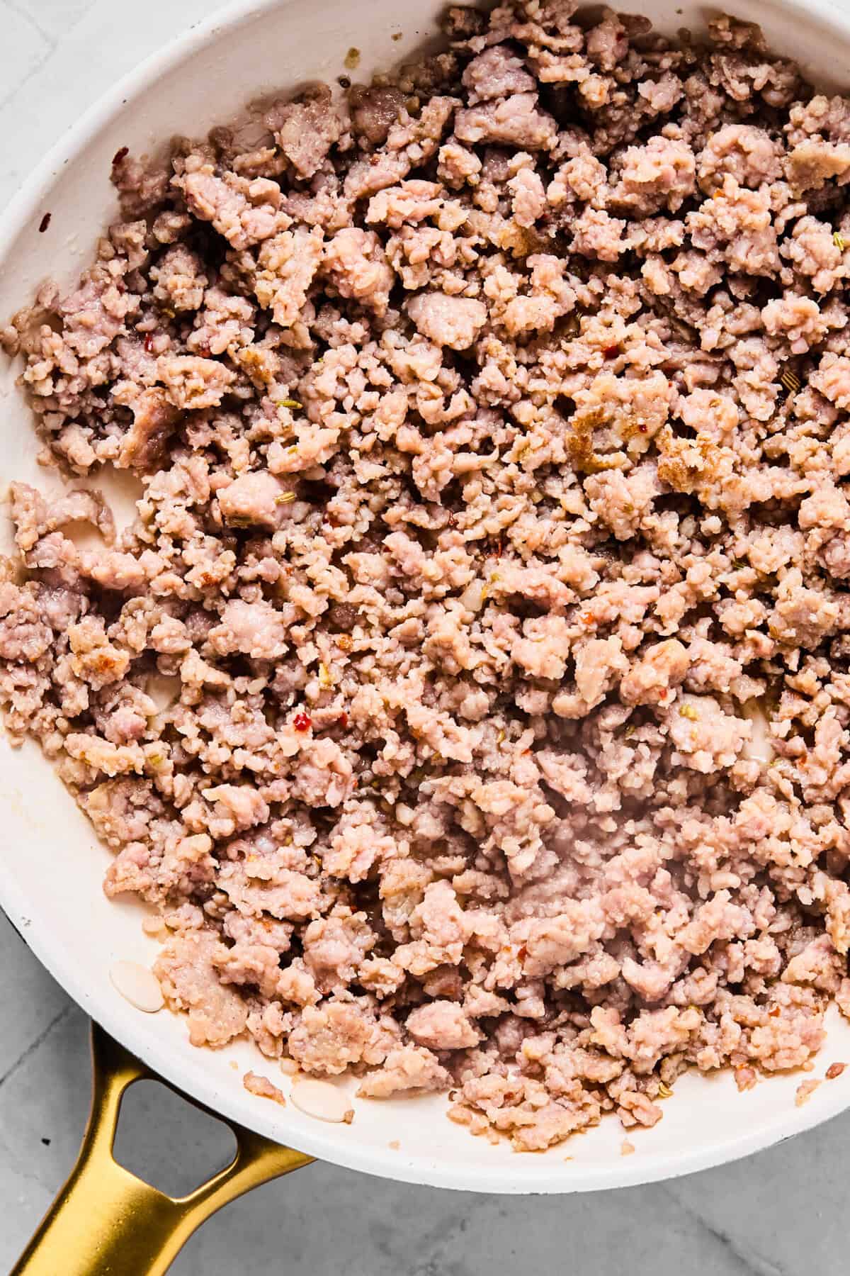 browning the sausage in a skilet