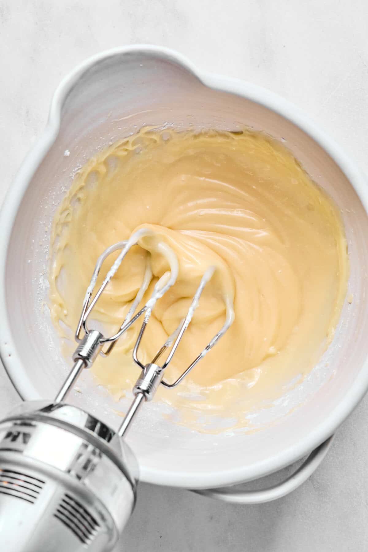 cream cheese, butter, and powdered sugar beaten in a bowl