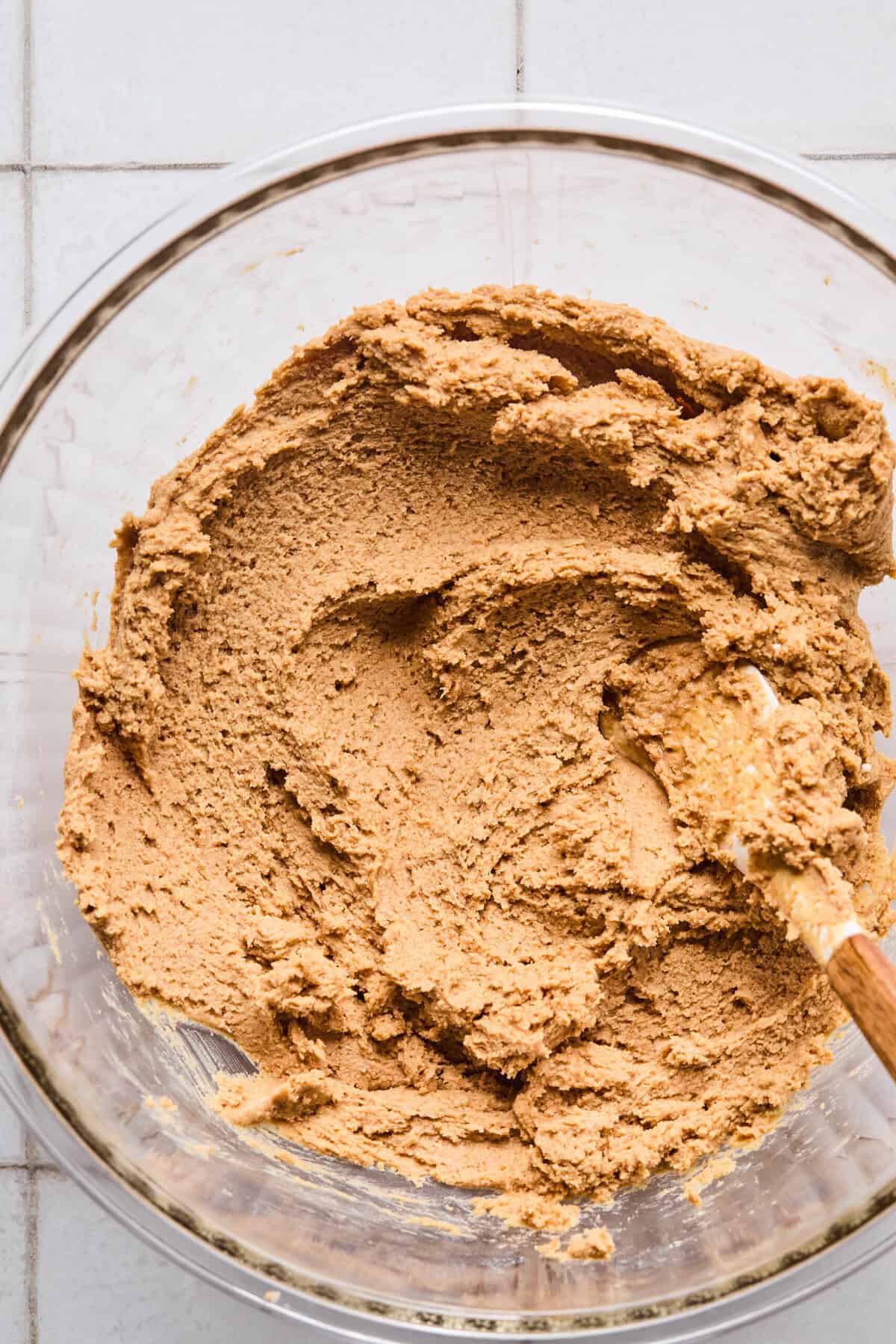 peanut butter, butter, powdered sugar, and graham cracker crumbs mixed in a bowl