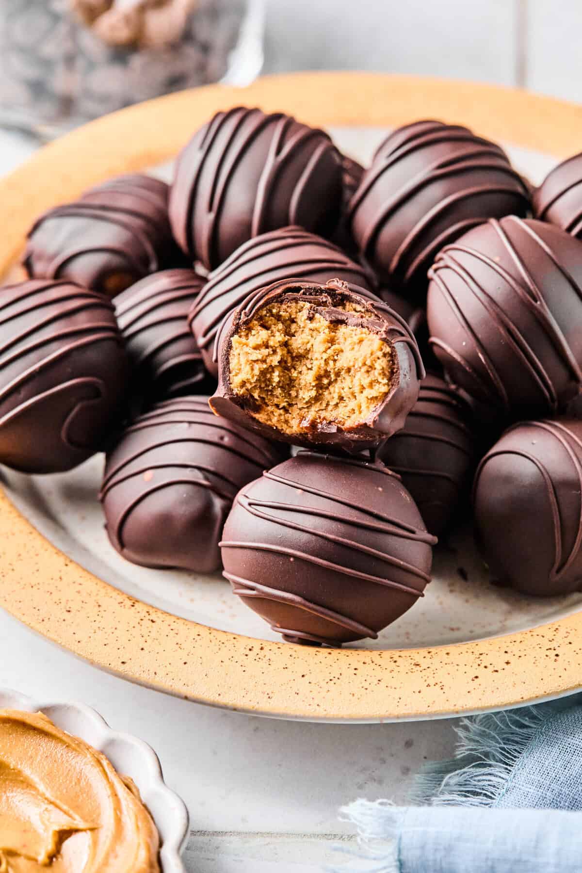 a close-up bite shot of peanut butter balls on a plate