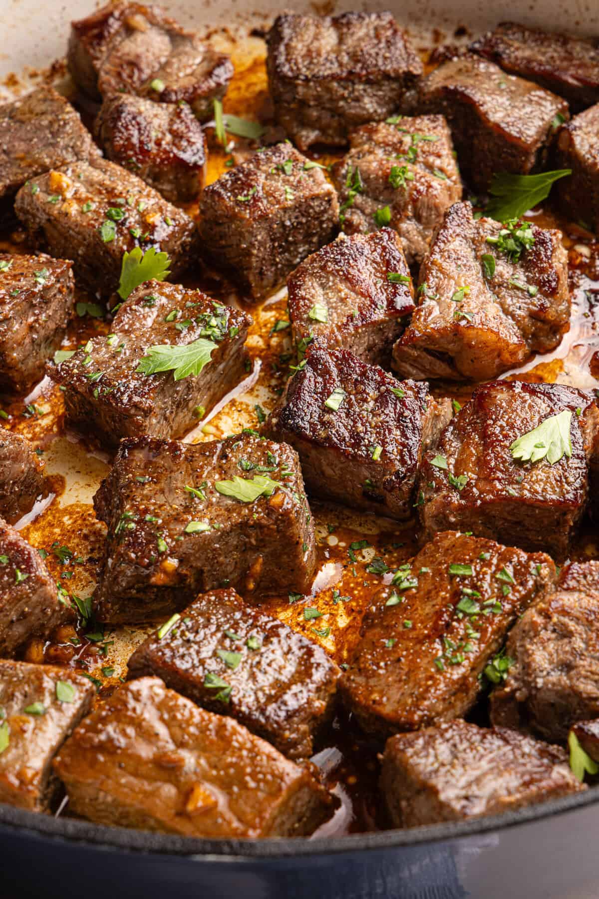 garlic butter steak bites close up in a pan