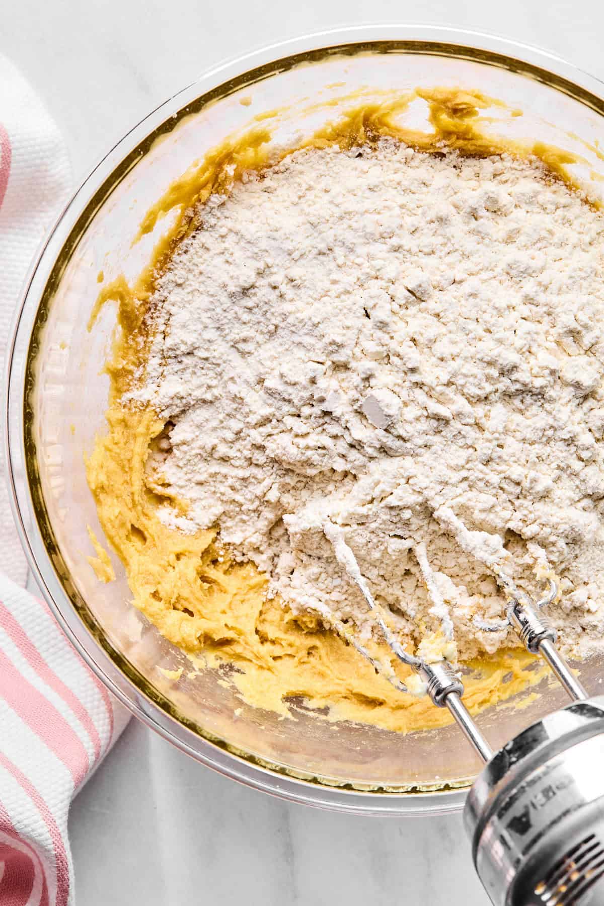 dry ingredients being added to wet for cookies