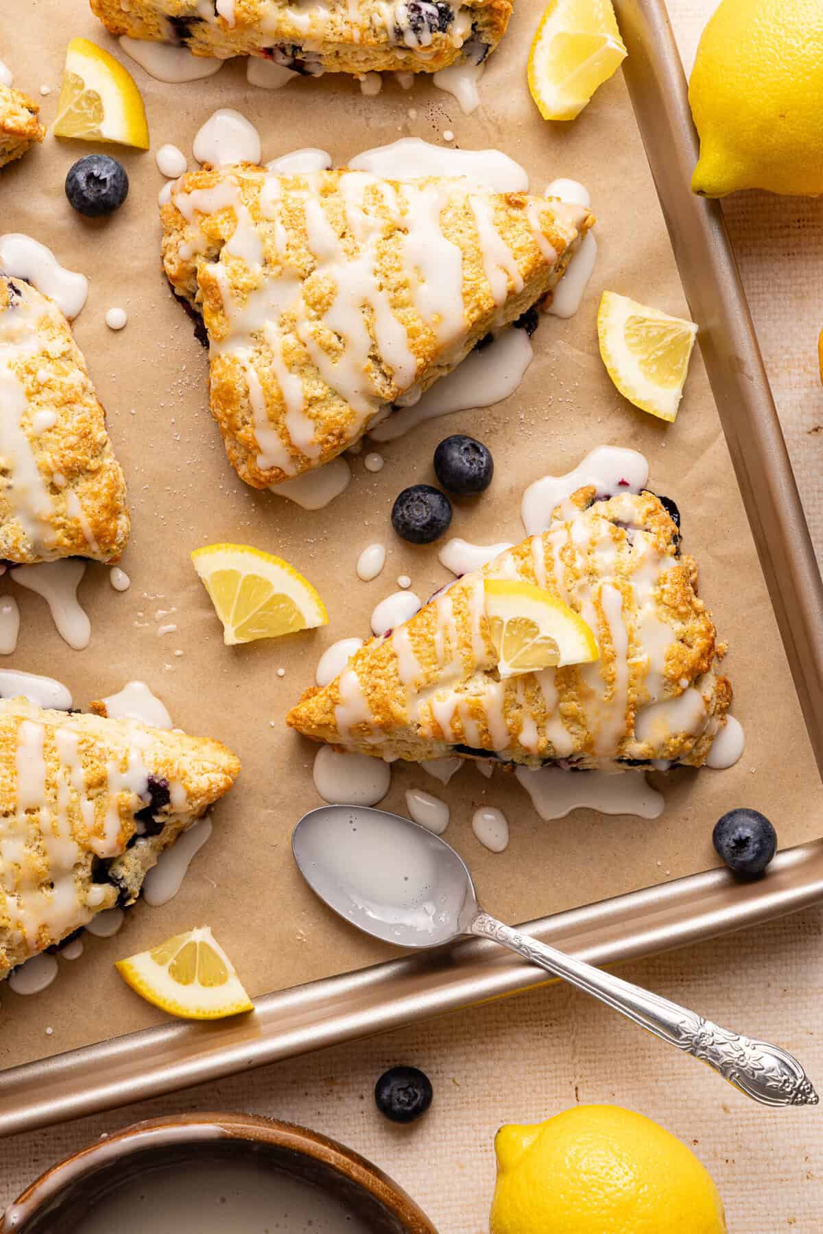 a baking sheet with parchment and scones
