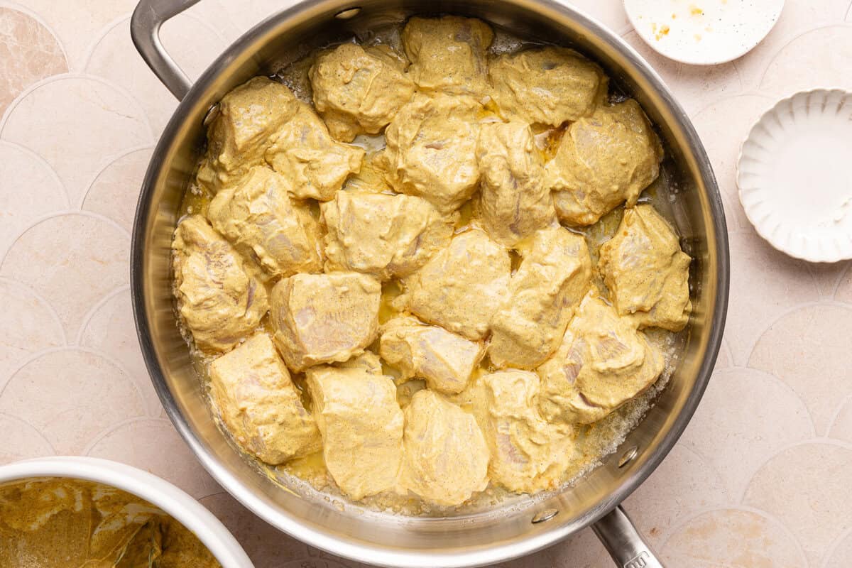 chicken cooking in a pan