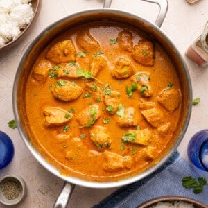 butter chicken in a stainless steel pan