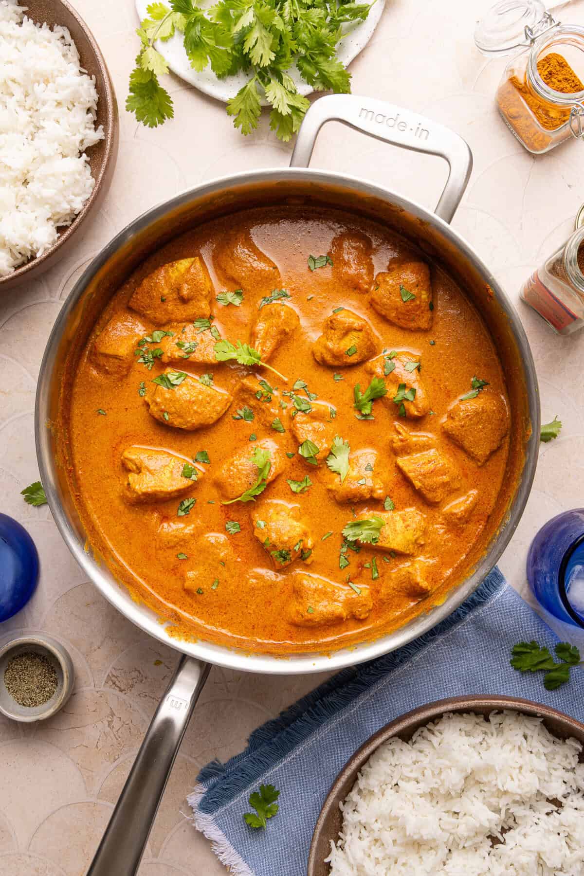 butter chicken in a stainless steel pan