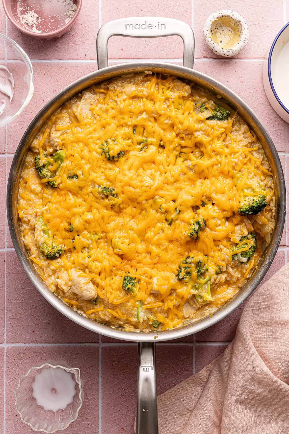 cheesy chicken broccoli rice casserole in a skillet