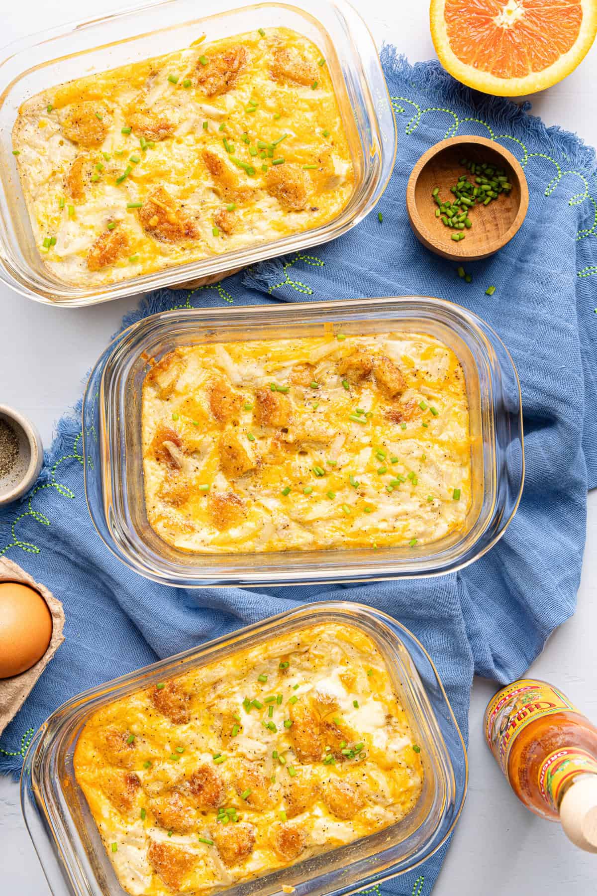 meal prep hash brown scramble bowls on a blue napkin