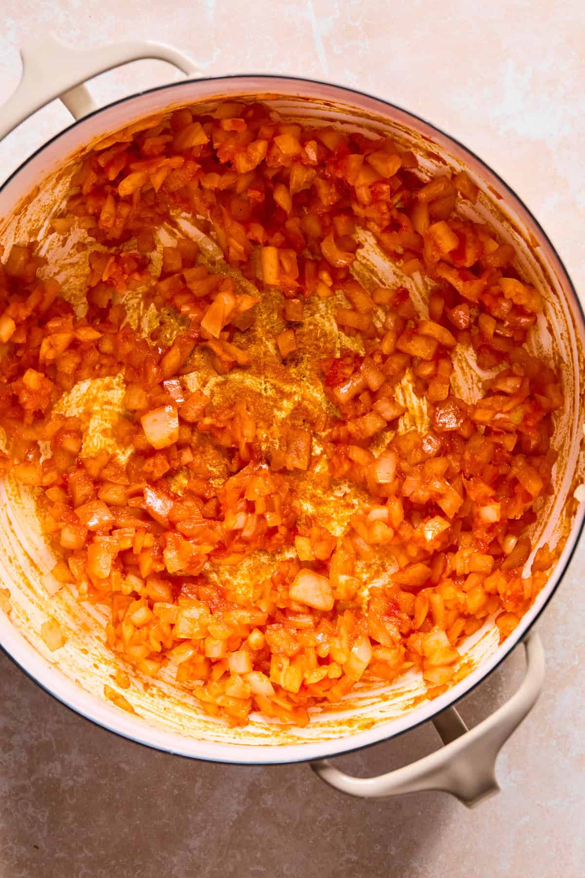 Tomato paste added to Dutch Oven with onion and garlic.