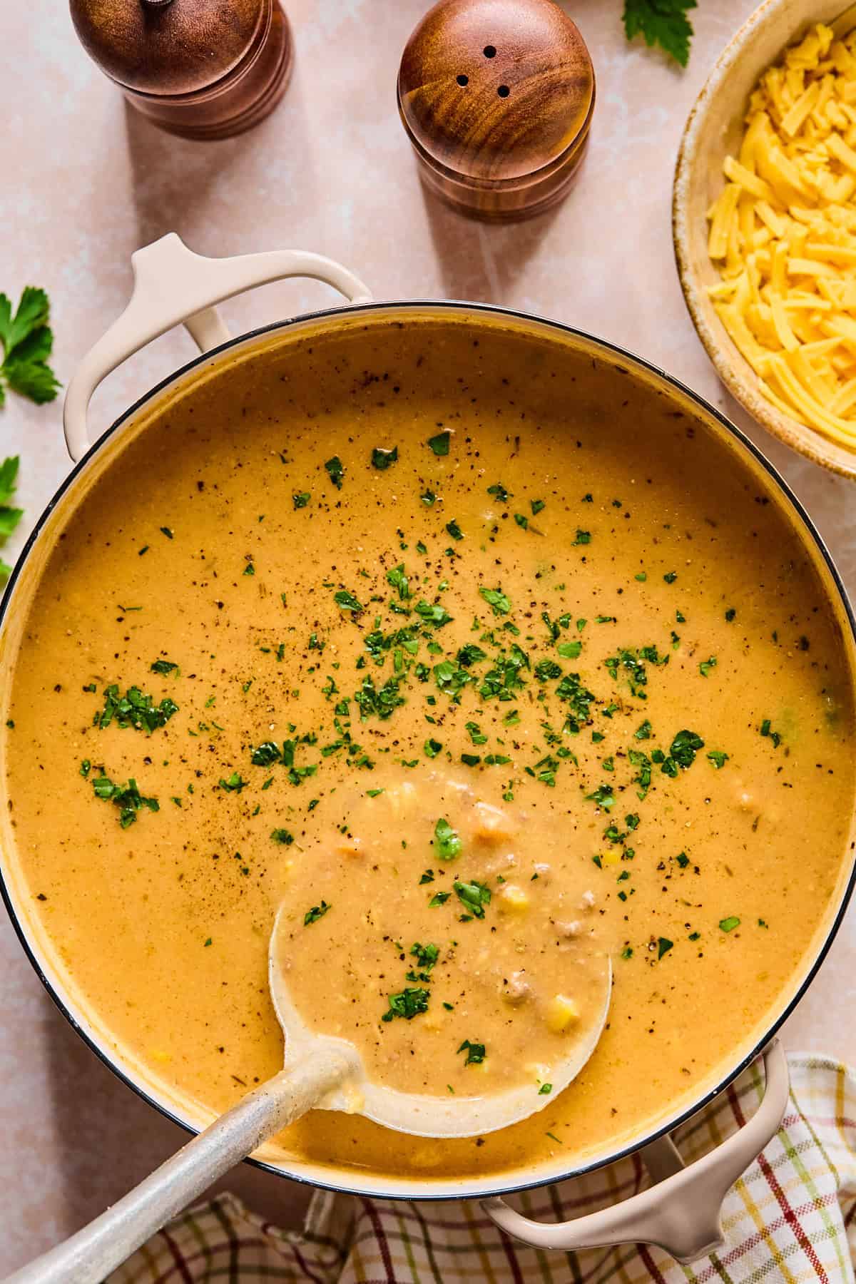 Pot of shepherd’s pie soup with a ladle scooping up a serving.