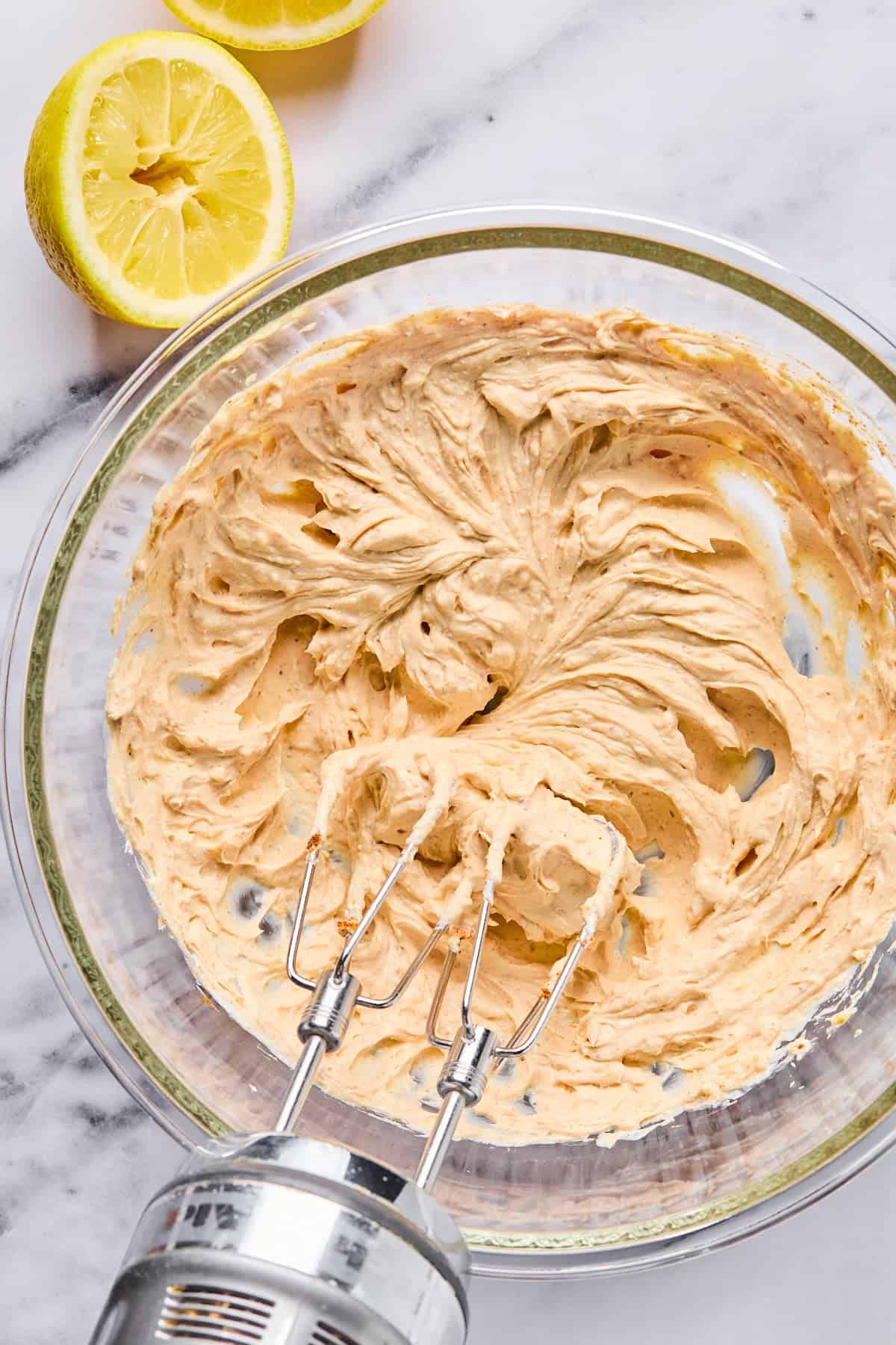 Cream cheese, Greek yogurt, garlic, and seasonings blended together in a bowl until smooth and creamy