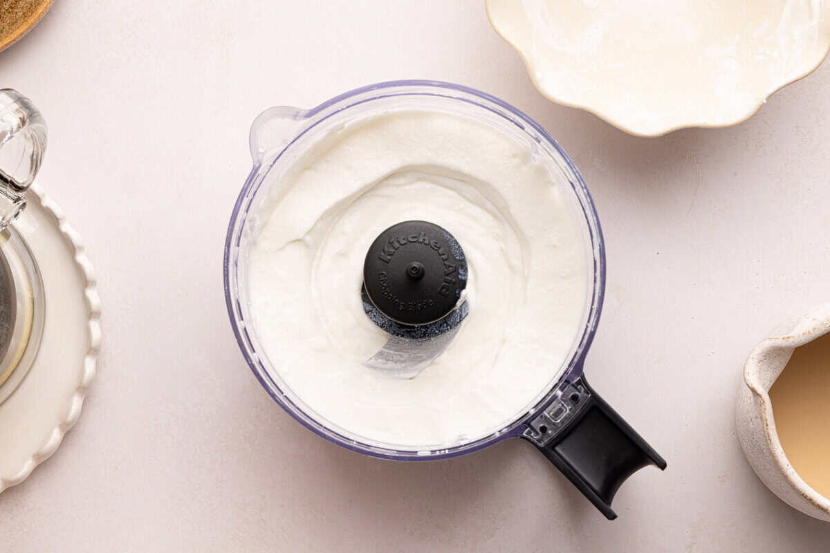 cottage cheese being whipped in a food processor