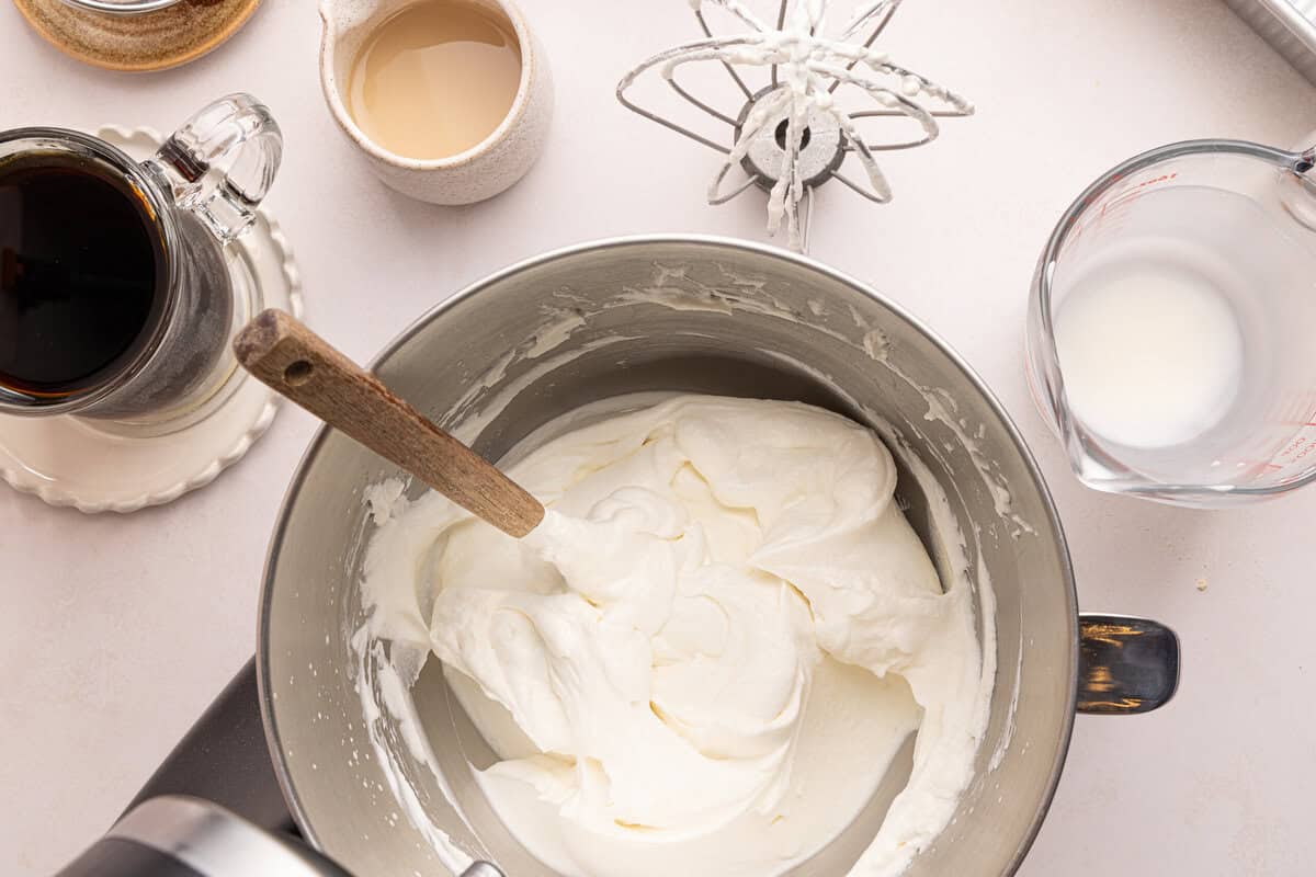 whipped cream in a bowl with a spatula