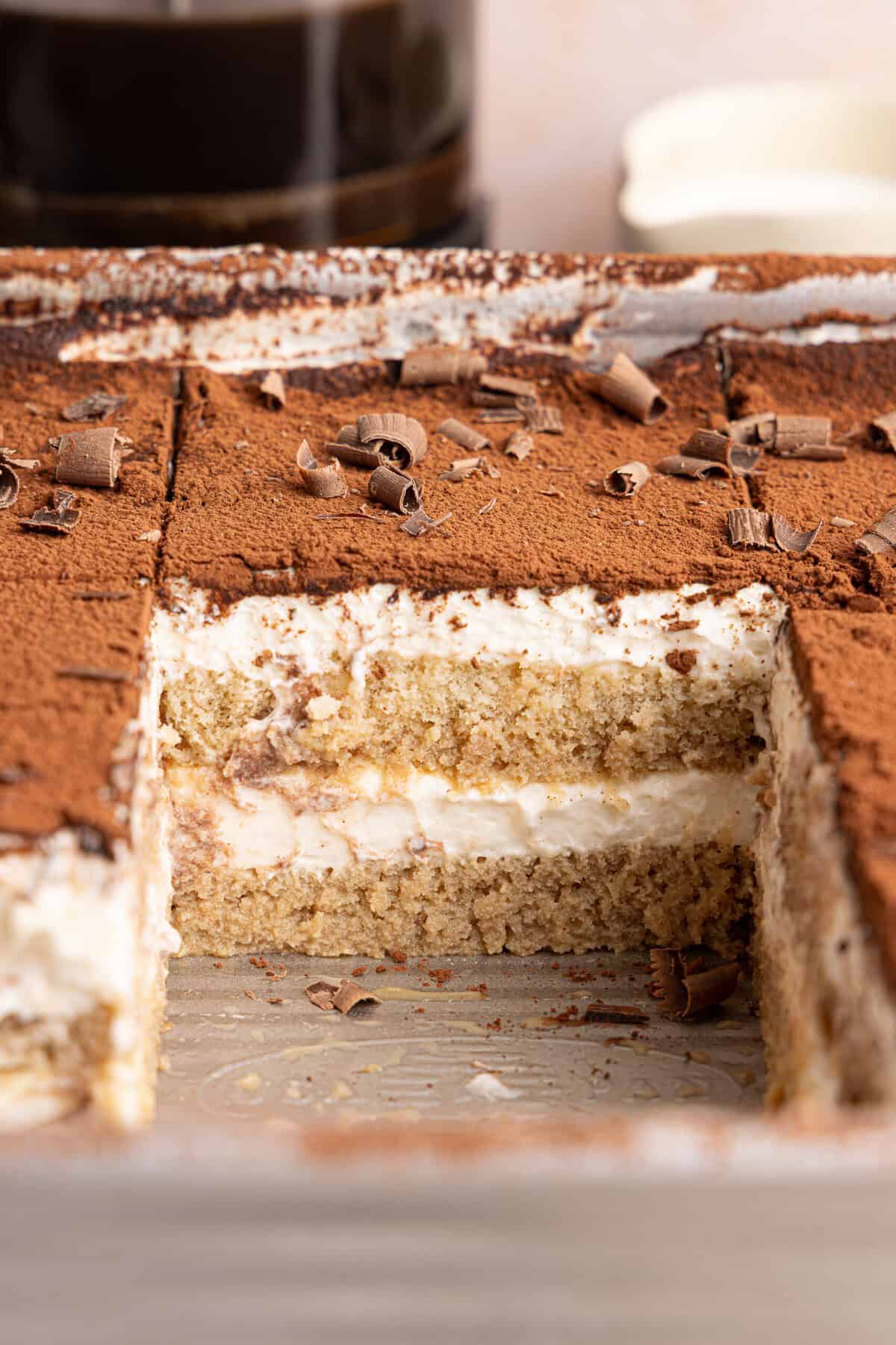 a side view of tiramisu in a pan