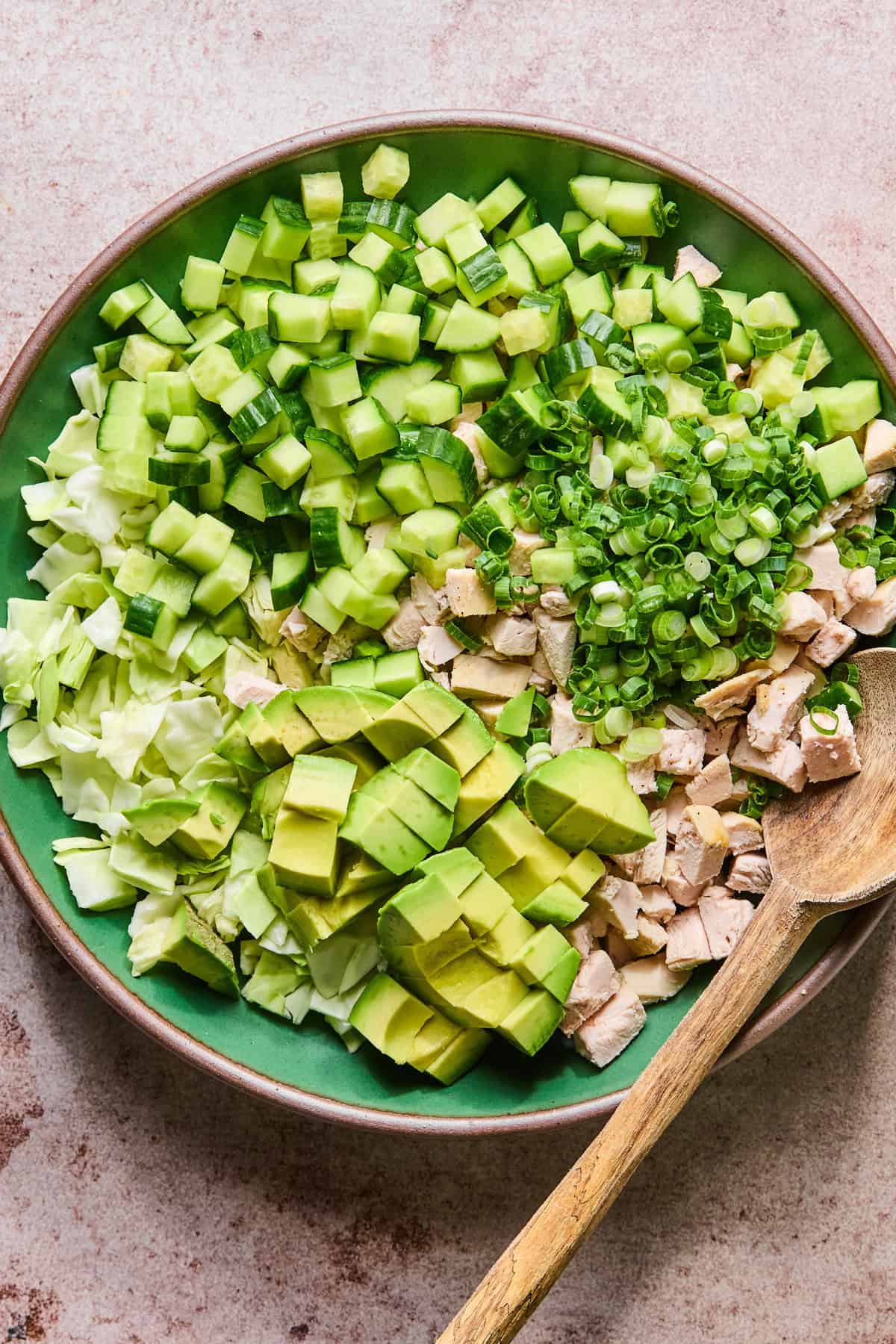 Ingredients for green goddess chicken salad in a bowl without dressing