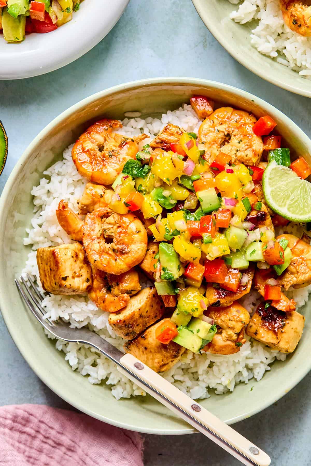 cilantro lime chicken and shrimp over rice with mango salsa