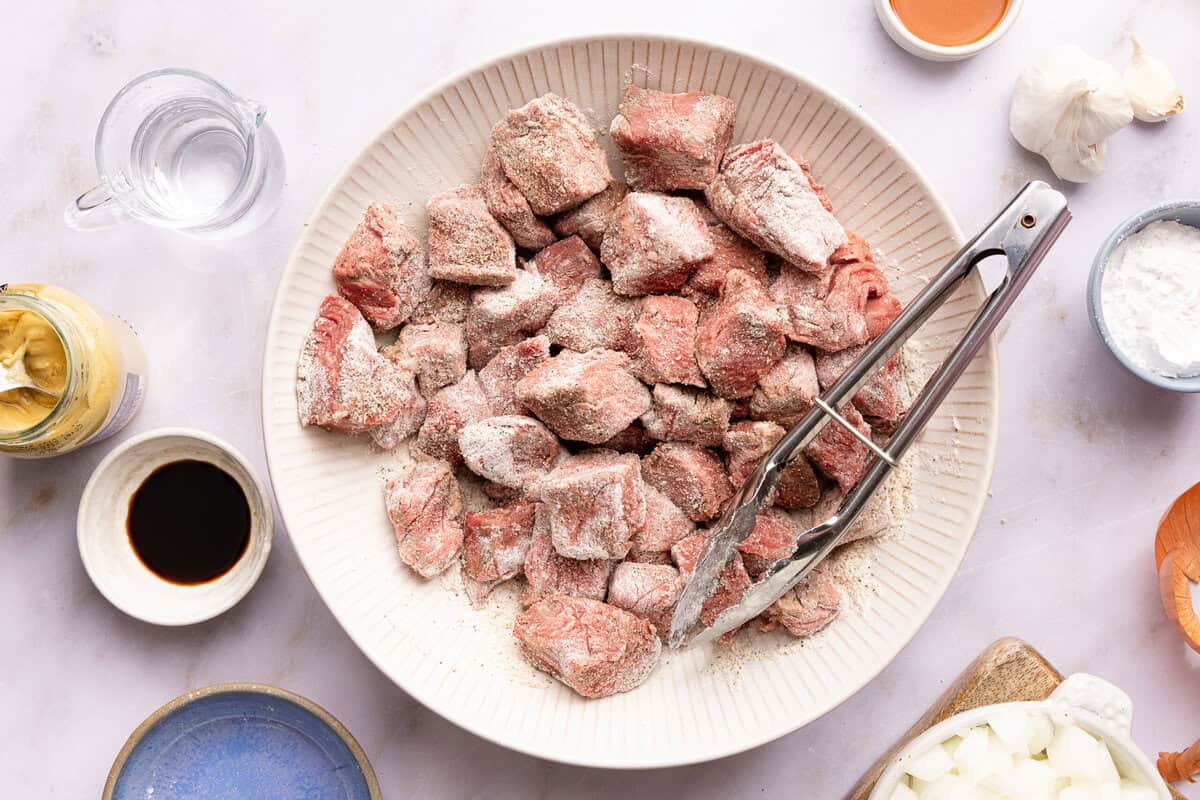 flour-coated beef tips in a bowl